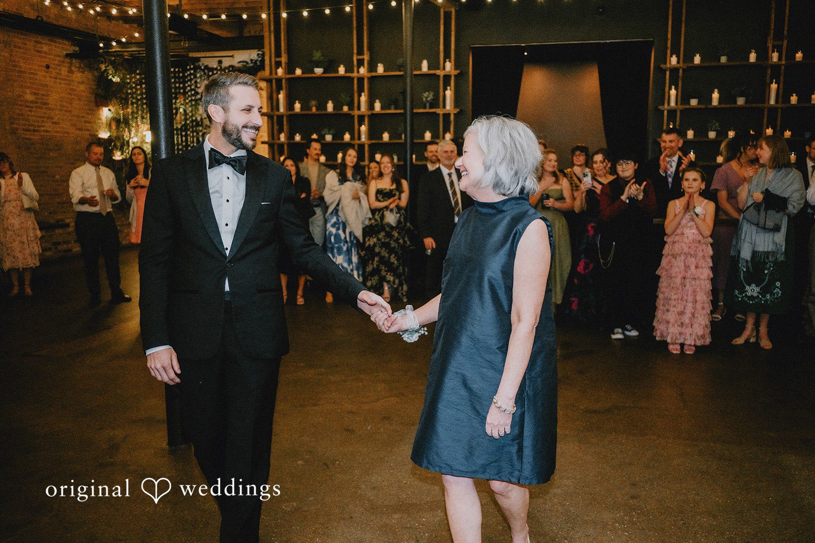 The groom dances with his mother
