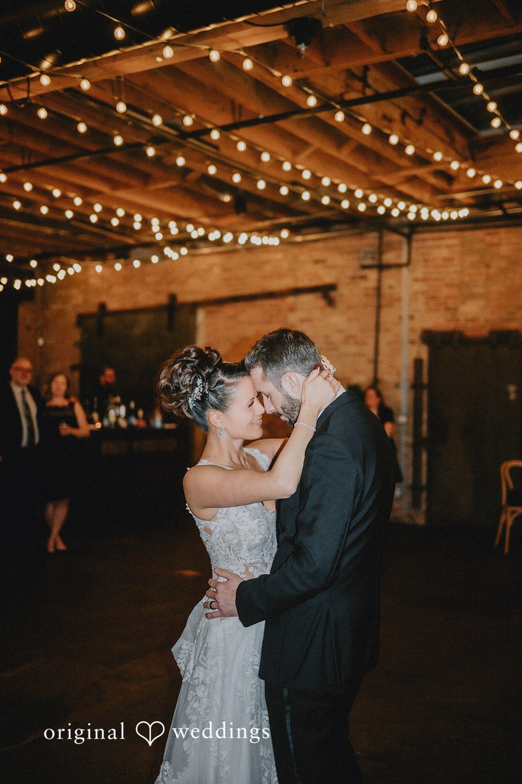 The couple takes their first dance