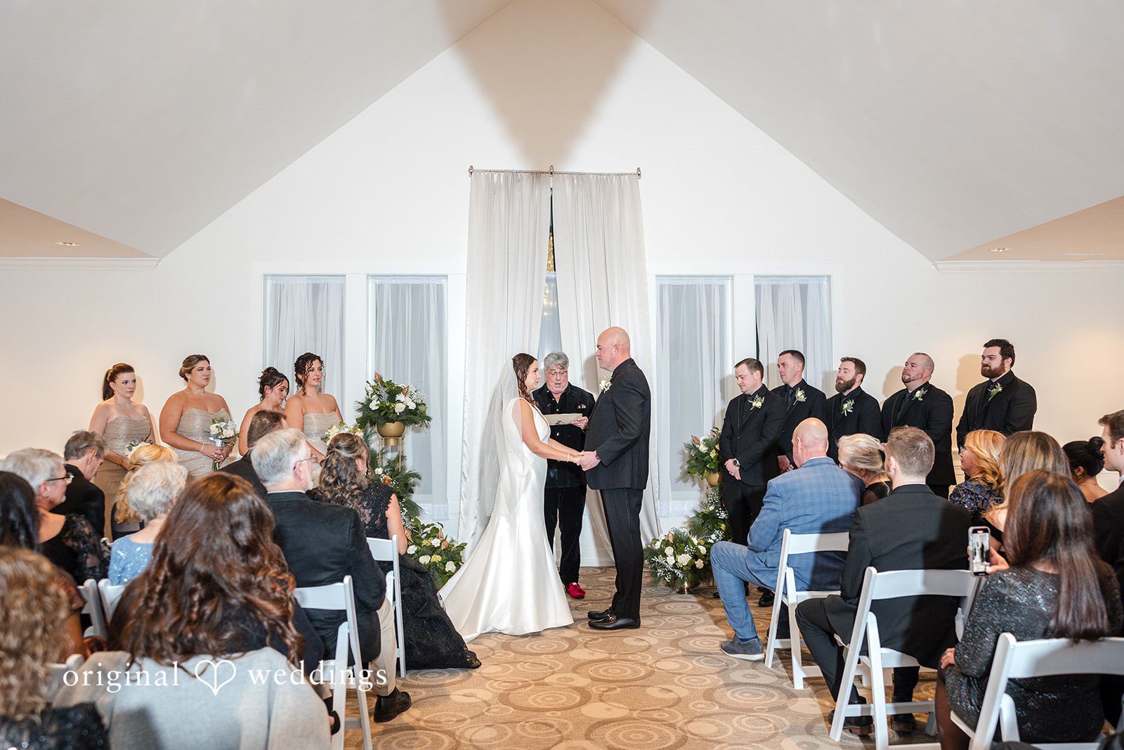 Couple exchanging vows during ceremony at The Cape Club of Falmouth captured by Boston wedding photographers from original weddings