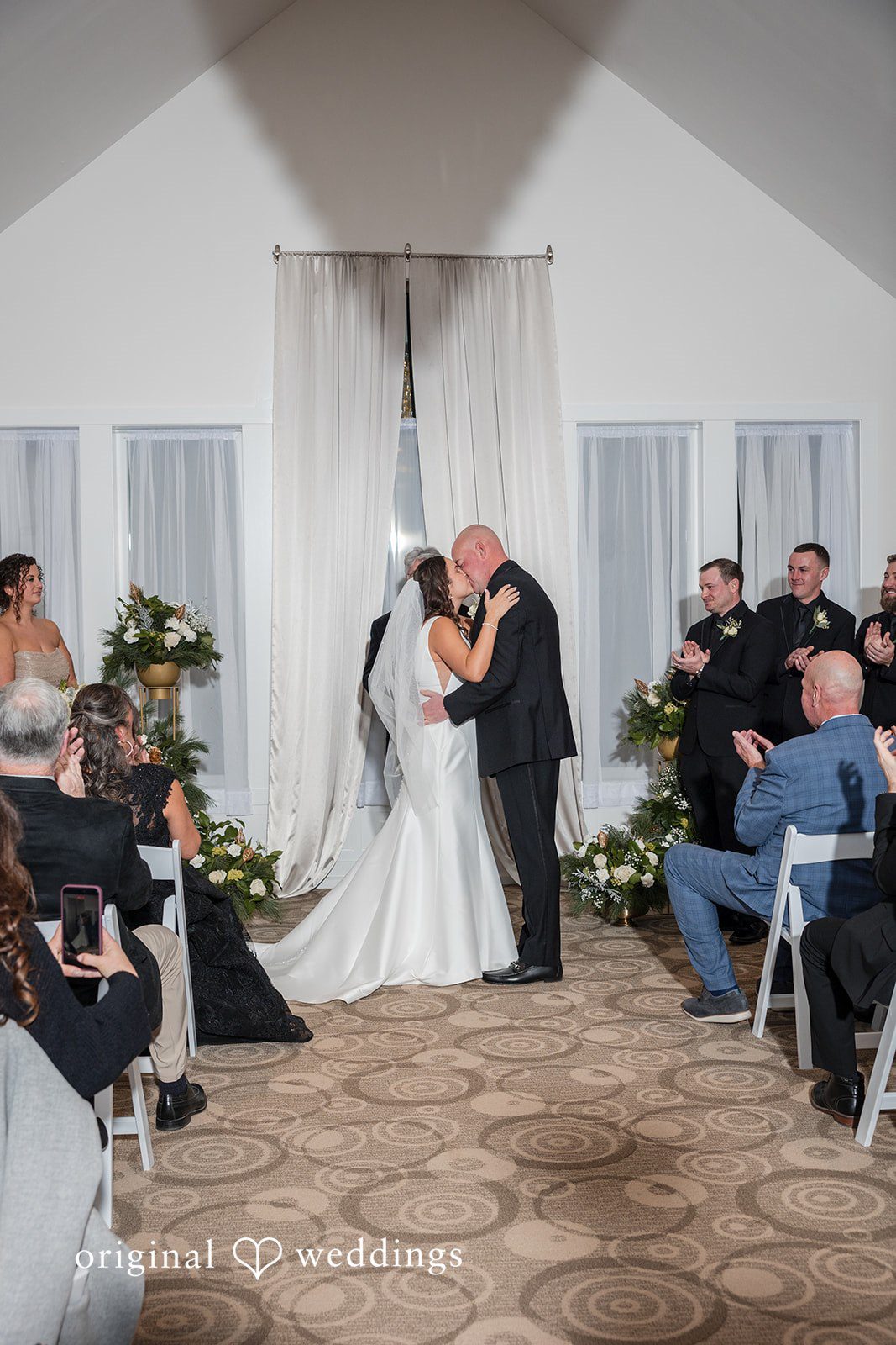 Romantic first kiss moment during ceremony