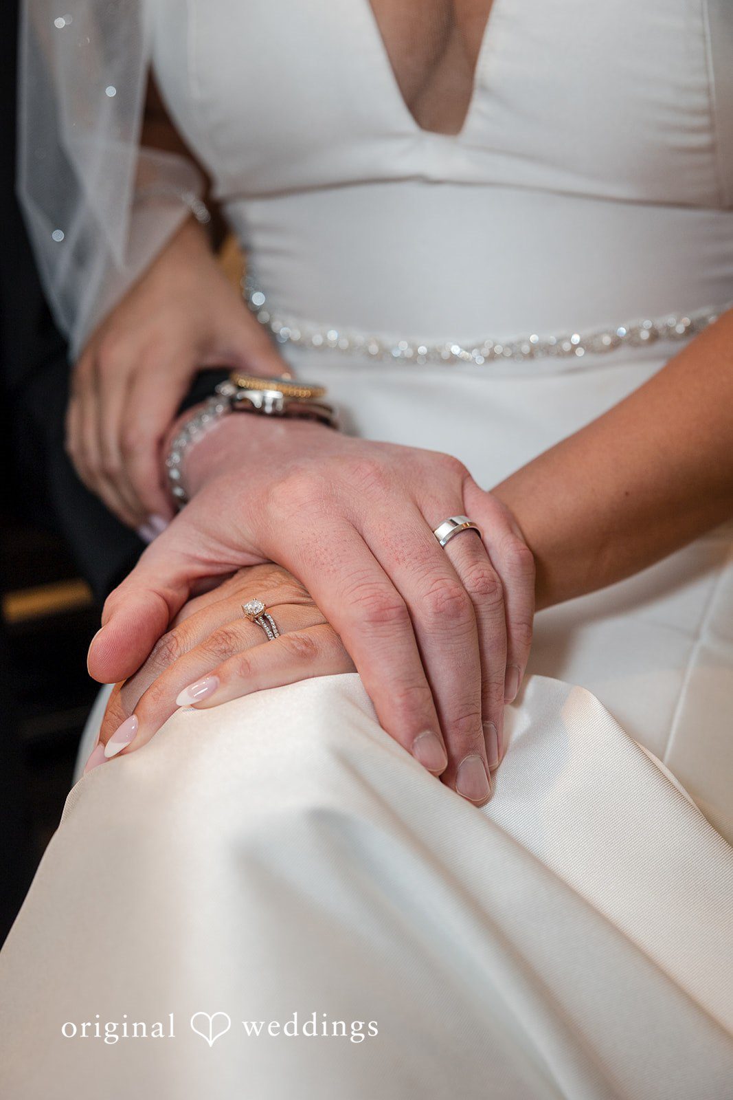 Romantic picture of couple's hands with rings