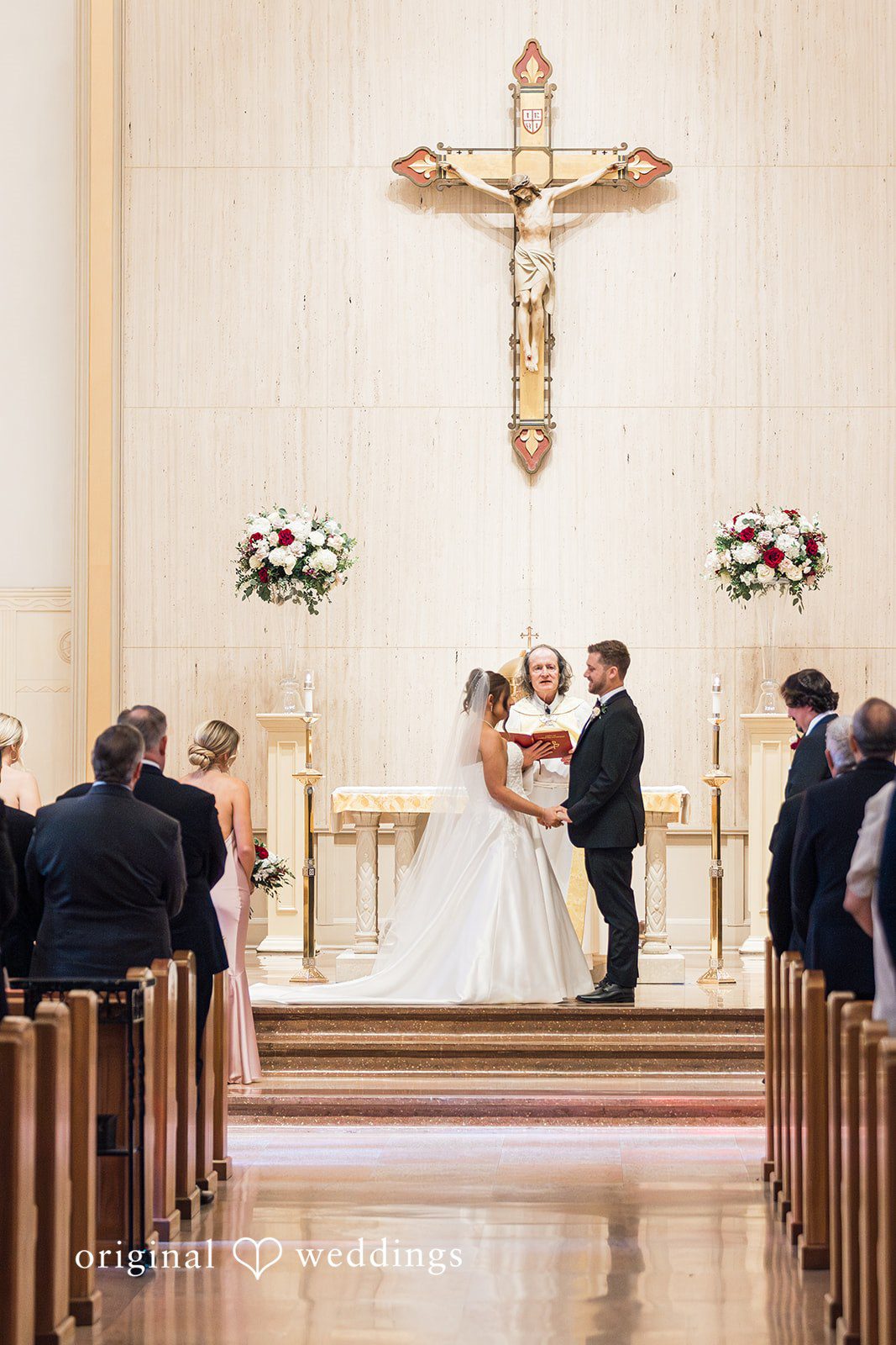 Couple standing before the priest at The Carlisle Room