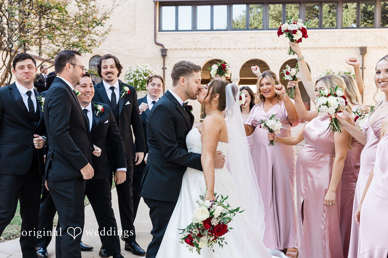 Emotional wedding kiss scene at The Carlisle Room