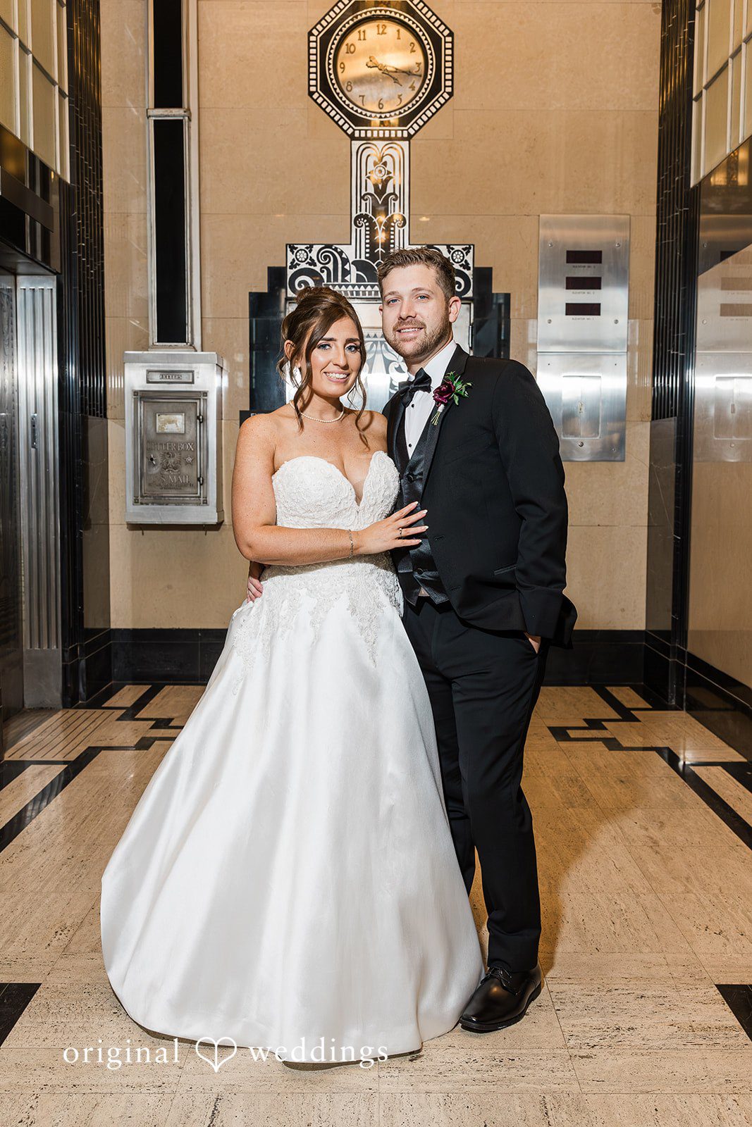 Bride and groom posing together with smiles at The Carlisle Room