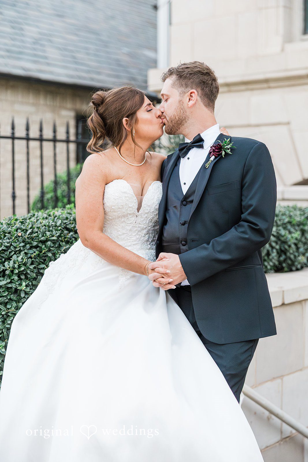 Dallas wedding photographers capturing emotional wedding kiss at The Carlisle Room by Original Weddings