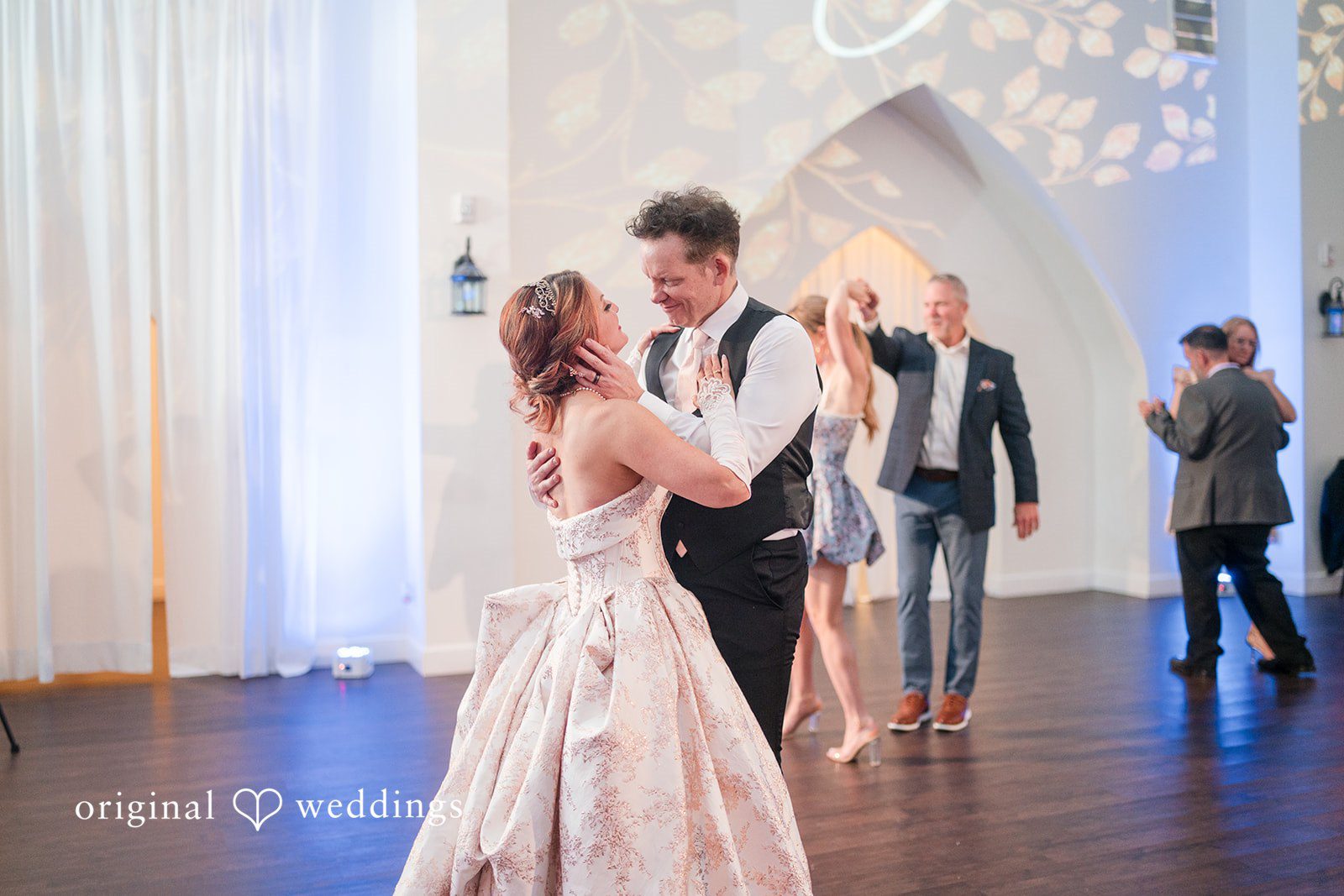 Joyful couple dancing together during celebration