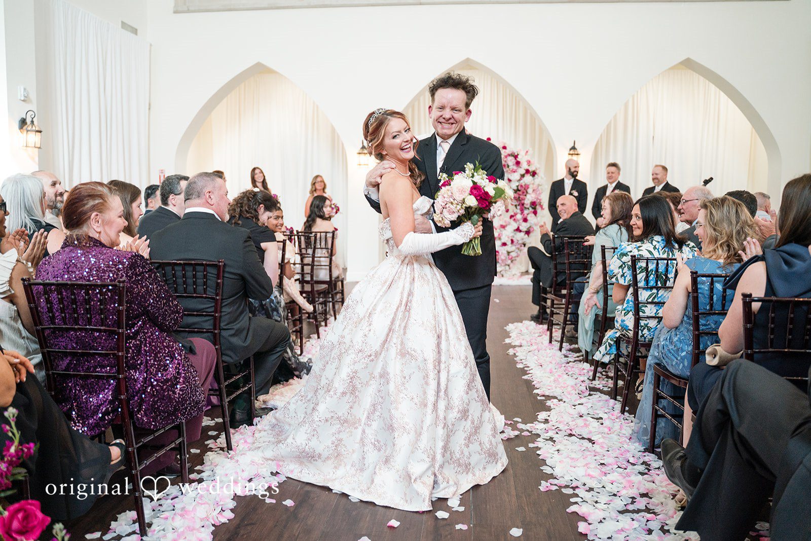 Dallas Wedding Photographers capturing couple hugging and smiling at The Castle at Rockwall by Original Weddings