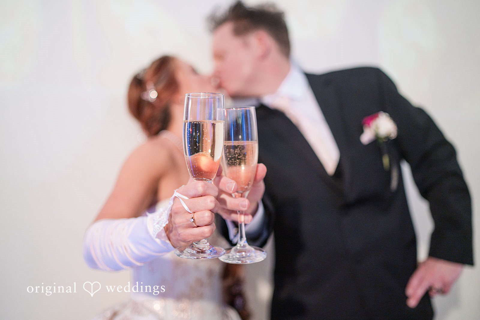 Elegant kiss captured during celebration