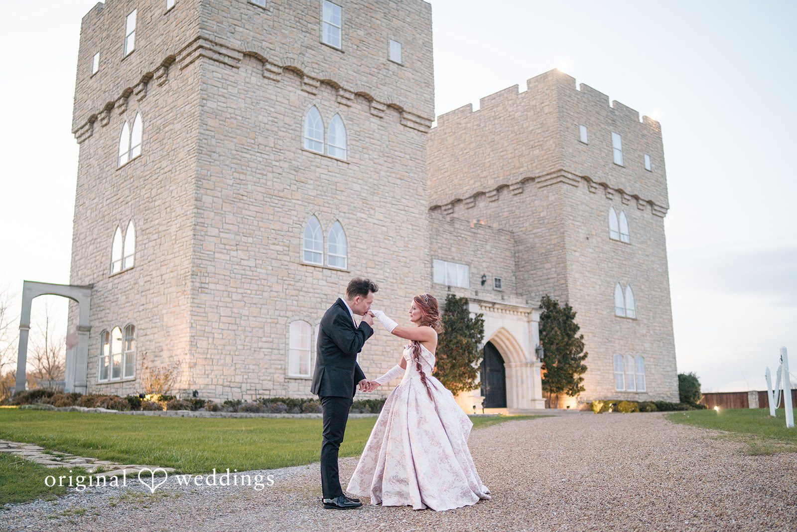 Dallas Wedding Photographers capturing romantic hand kiss moment at The Castle at Rockwall by Original Weddings