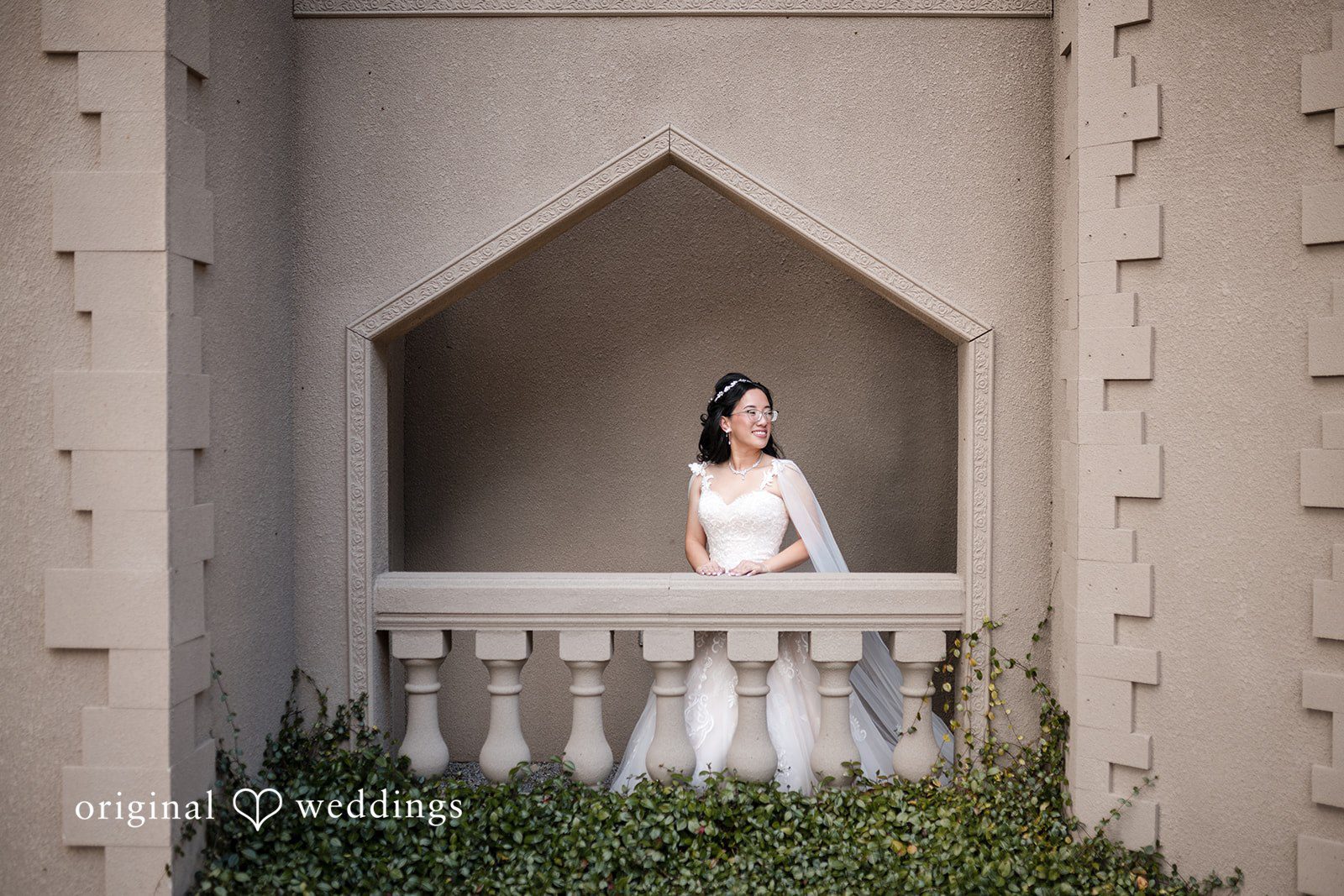 Nghi + Christopher Elegant bride smiling beautifully in her wedding gown at The Castle at Wildwood Gardens