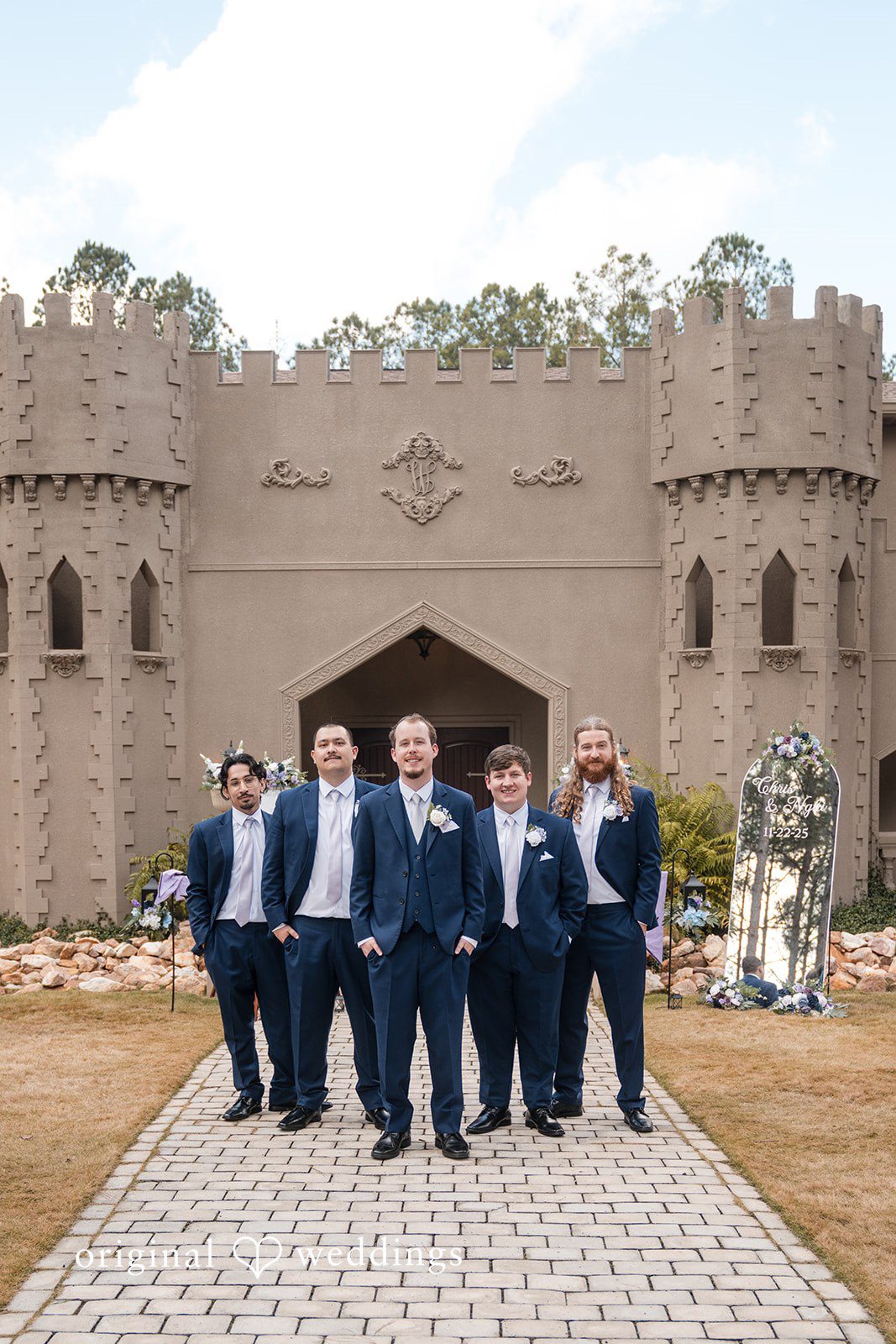 Nghi + Christopher Stylish groom and groomsmen posing together before the ceremony at The Castle at Wildwood Gardens