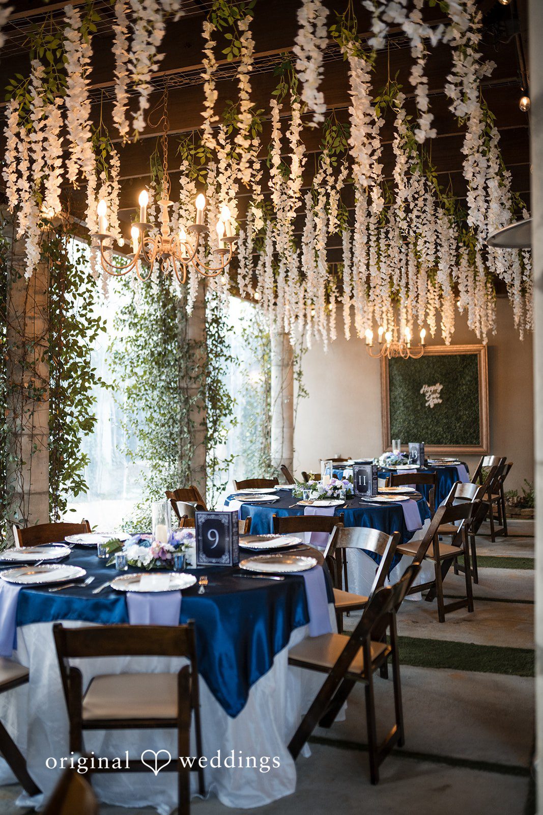 Nghi + Christopher Elegant wedding chairs and table settings inside the reception hall at The Castle at Wildwood Gardens