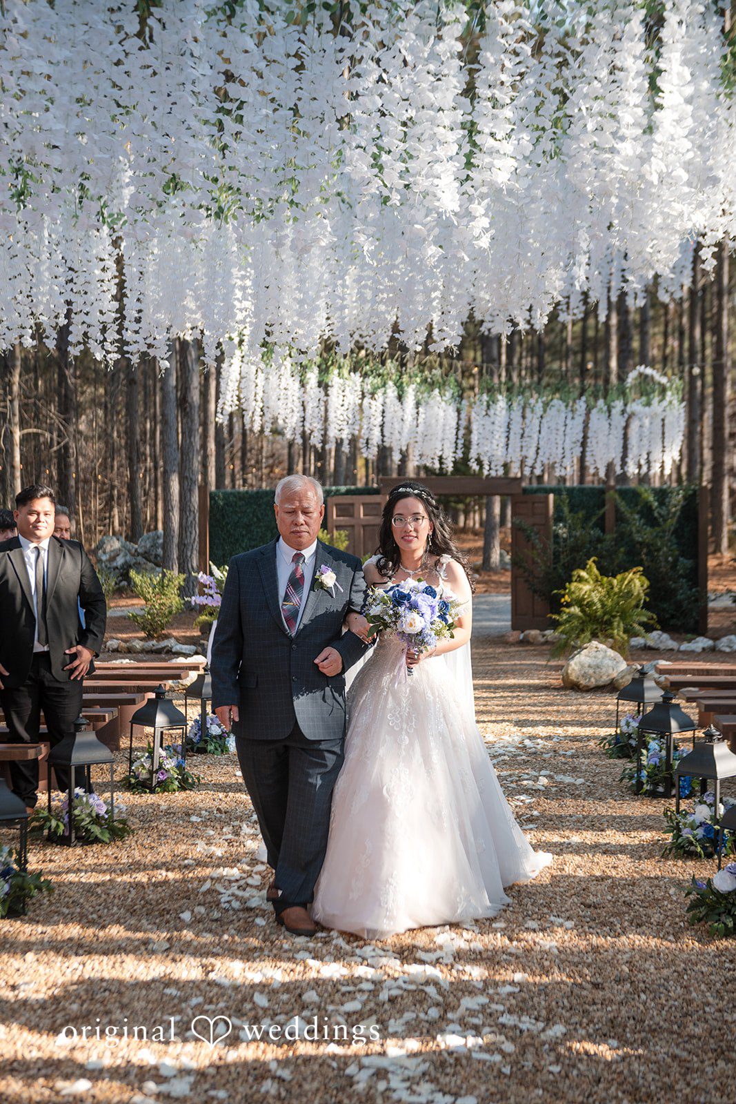 Nghi + Christopher Elegant bride entering the ceremony with emotional wedding expressions at The Castle at Wildwood Gardens