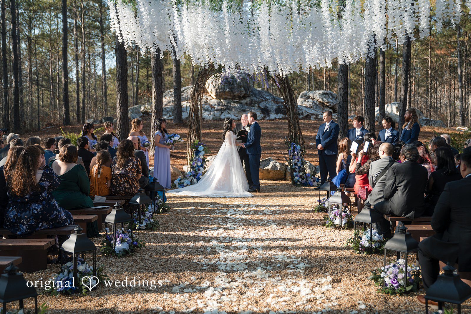 Nghi + Christopher Romantic couple sharing emotional eye contact during their wedding at The Castle at Wildwood Gardens