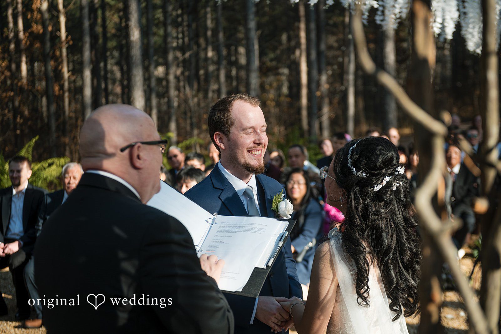 Nghi + Christopher Romantic wedding ceremony moment with the couple standing together at The Castle at Wildwood Gardens