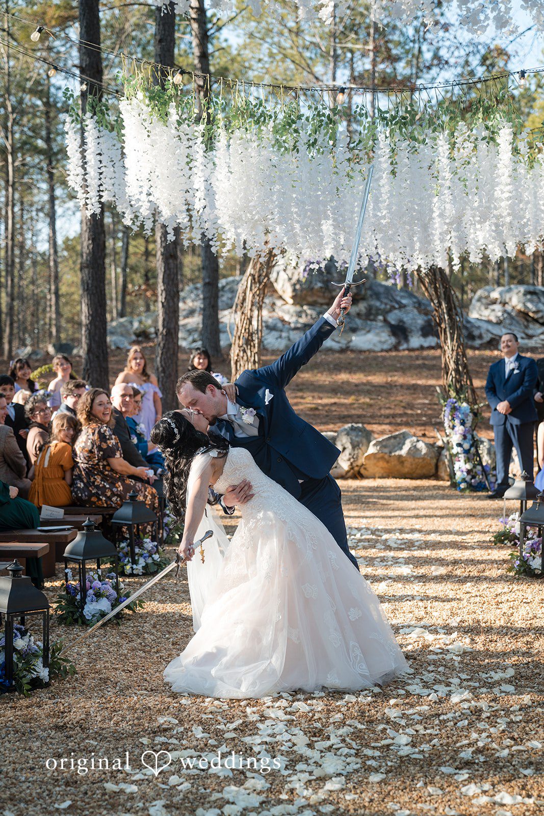 Nghi + Christopher Bride and groom sharing their kiss after the ceremony at The Castle at Wildwood Gardens