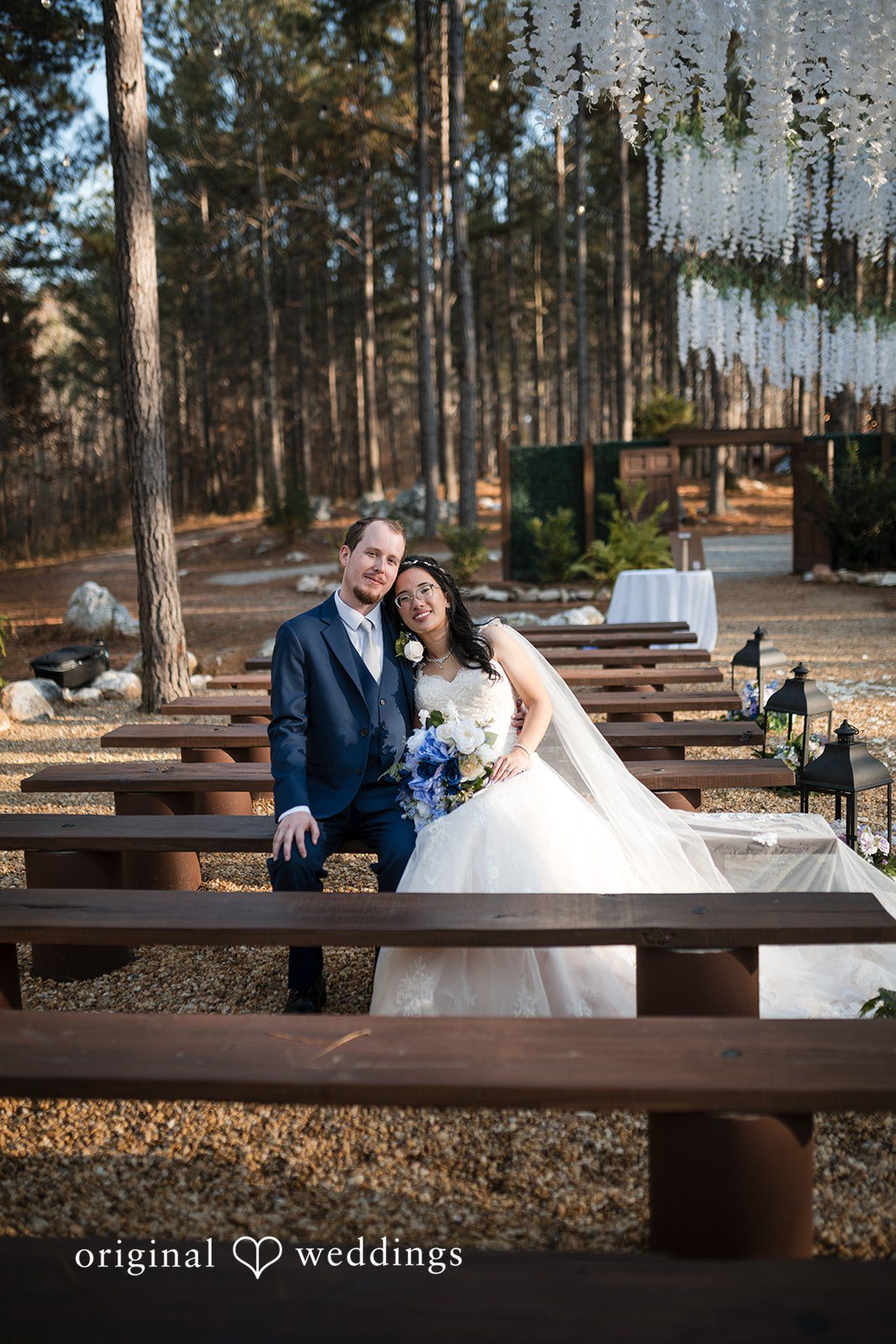 Nghi + Christopher Elegant wedding hug pose featuring the bride and groom at The Castle at Wildwood Gardens