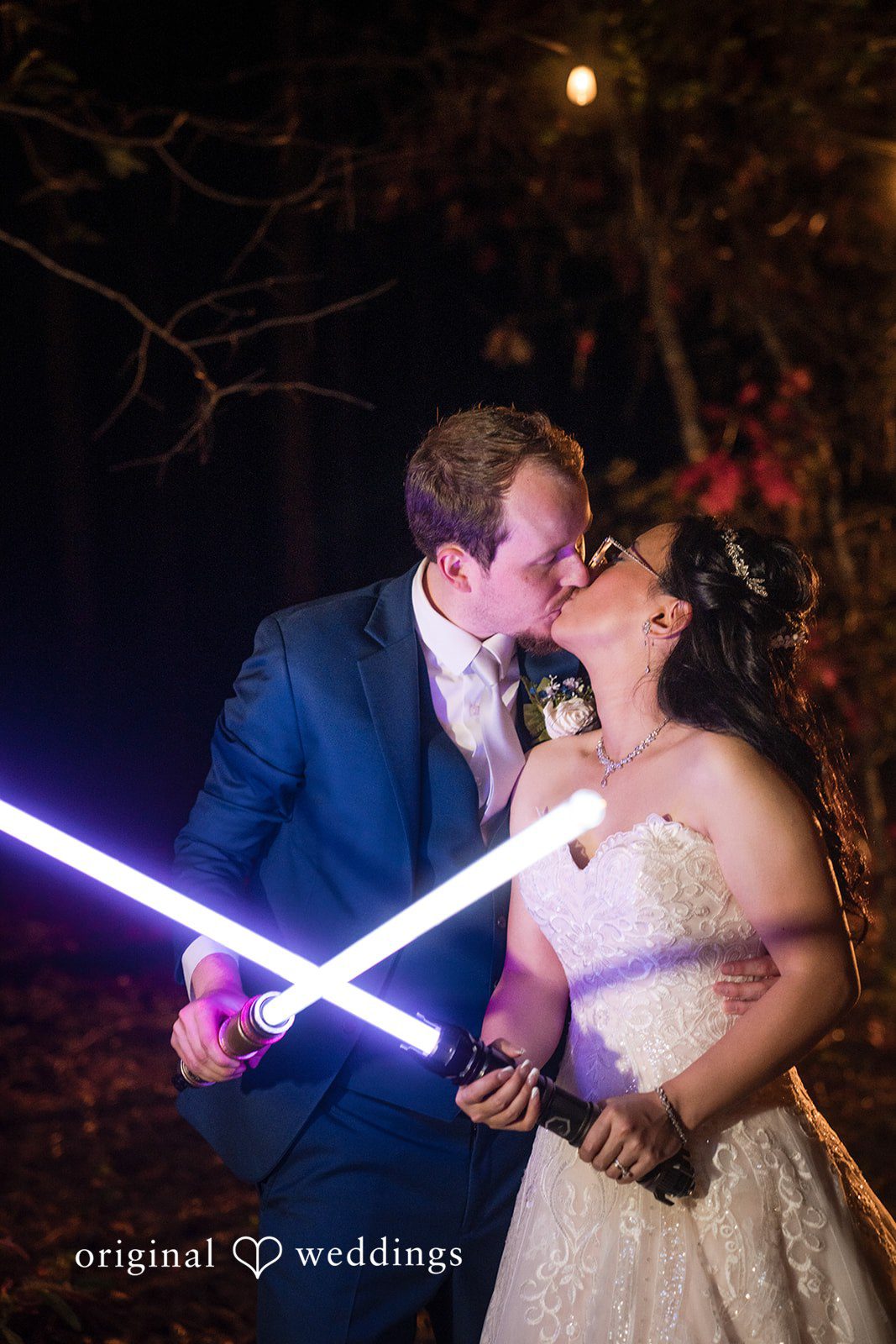 Nghi + Christopher Bride and groom sharing a loving kiss during the reception at The Castle at Wildwood Gardens