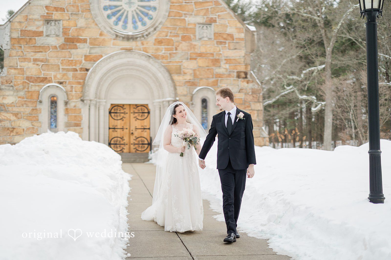 Boston Wedding Photographers capturing newlyweds enjoying an outdoor wedding moment at The Chapel at West Parish from Original Weddings