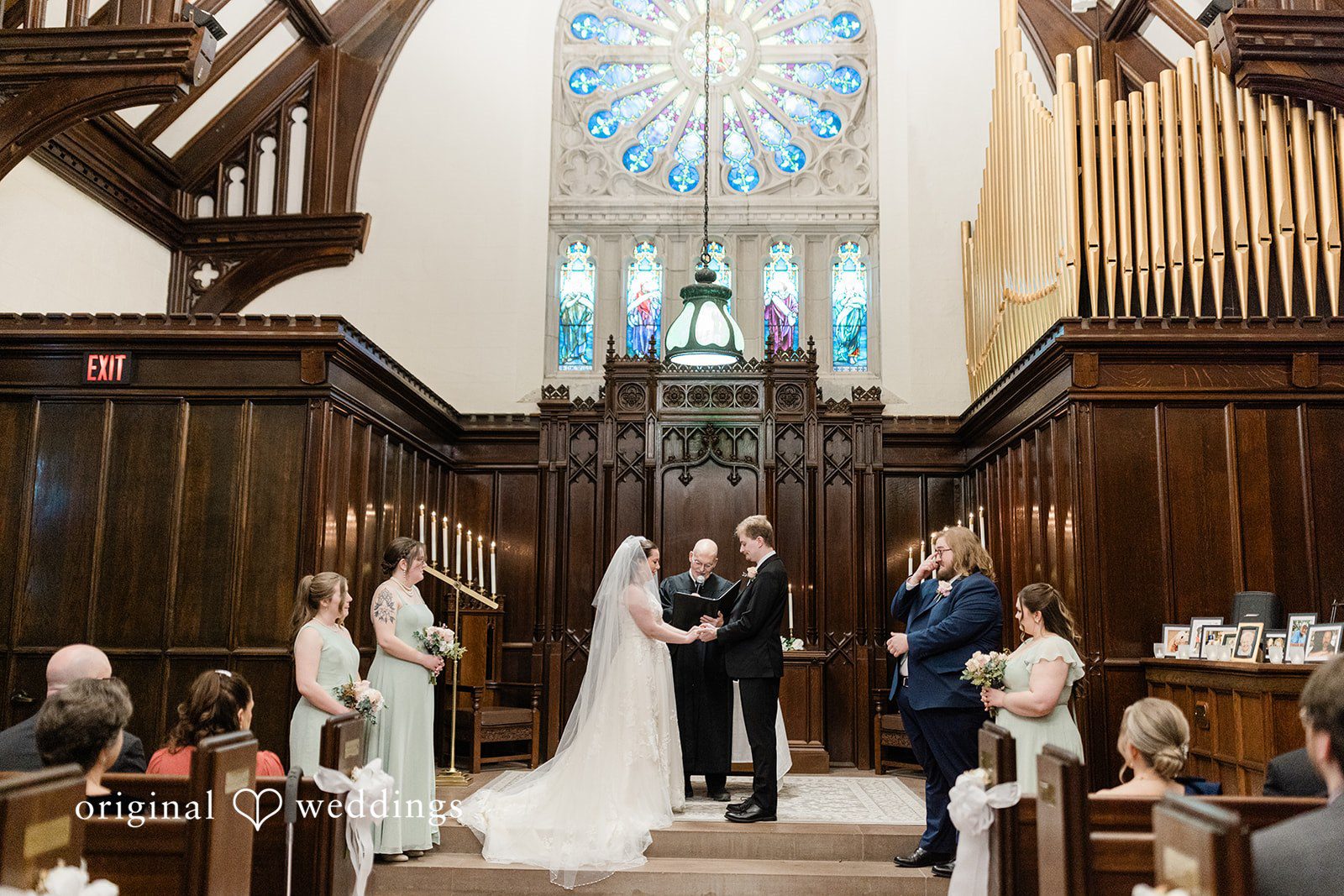 Wedding couple holding hands during ceremony