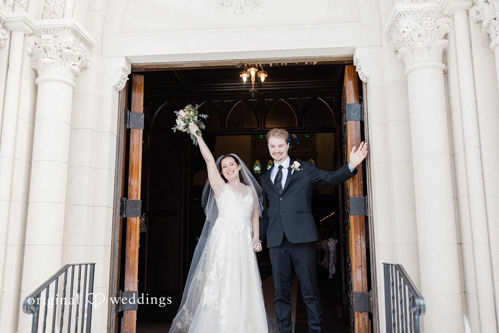 Boston Wedding Photographers capturing bride holding bouquet and groom’s hand near doorway at The Chapel at West Parish from Original Weddings