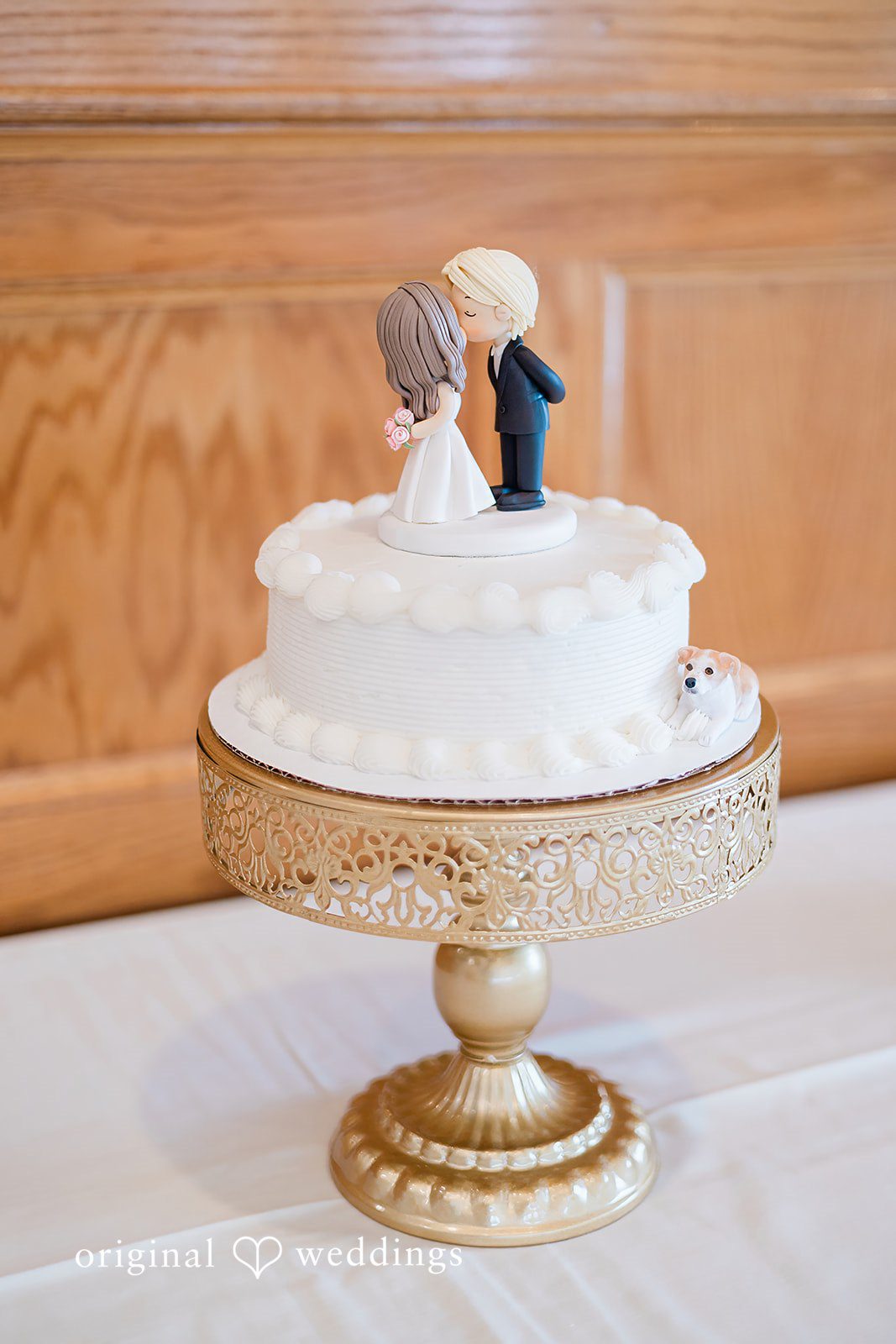 Elegant wedding cake with bride and groom topper at The Chapel at West Parish