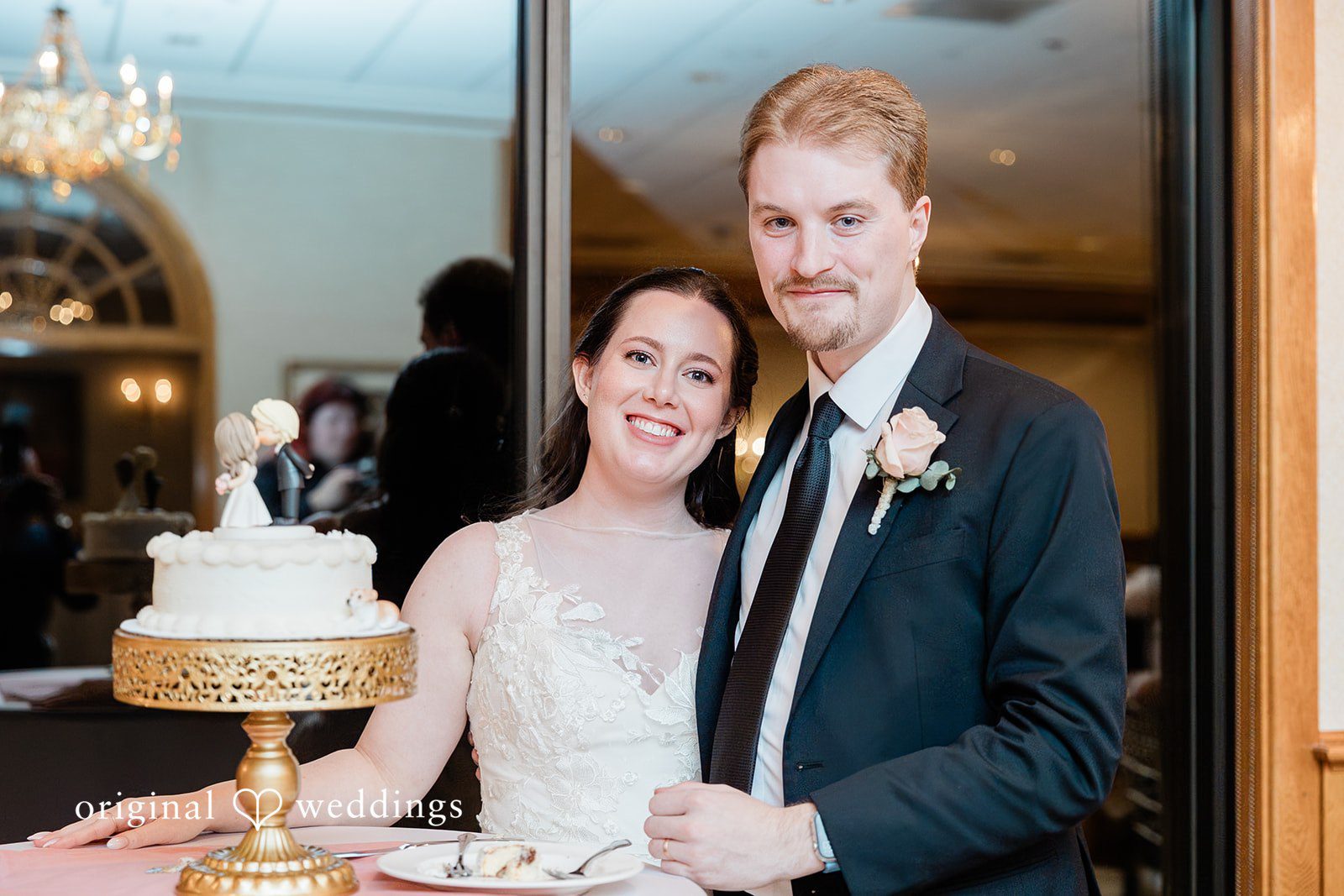 Boston Wedding Photographers capturing cake cutting moment at The Chapel at West Parish from Original Weddings