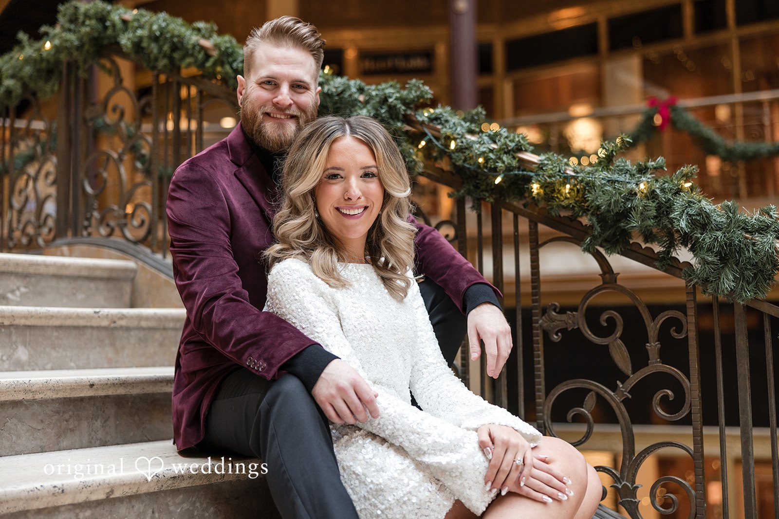 Beautiful couple seated in stairs in The Cleveland Arcade