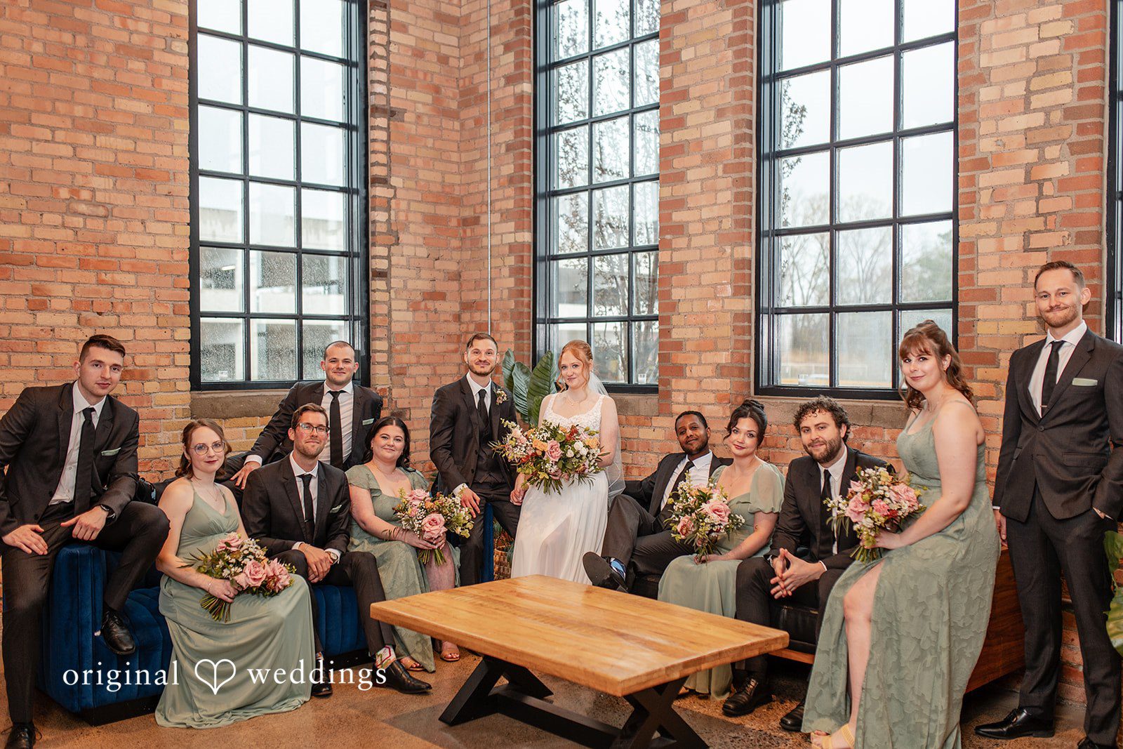 Minneapolis Wedding Photography capturing couple group photo with bridesmaids and groomsmen at The Essence Event Center by Original Weddings