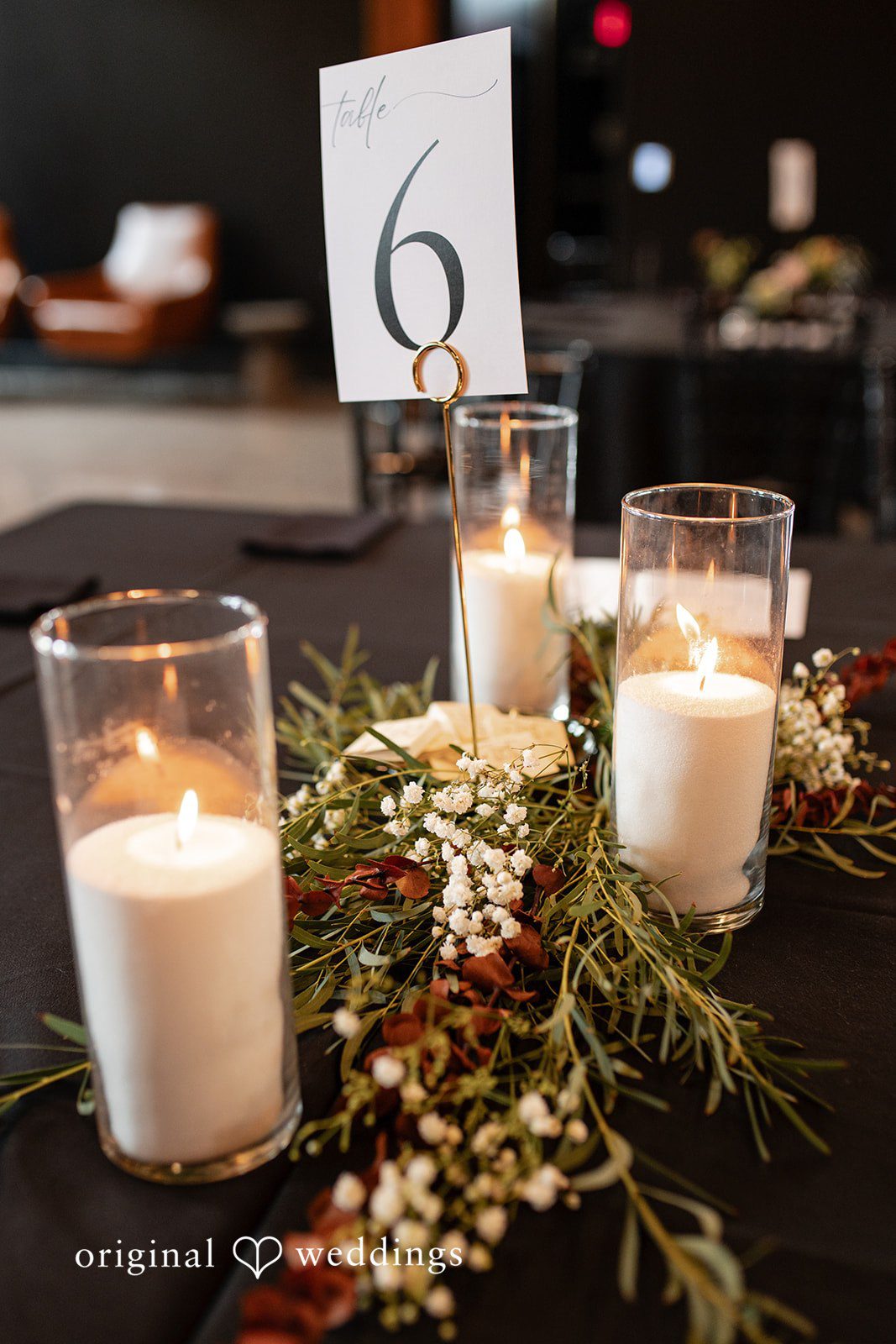 Elegant candles and flowers arrangement at The Essence Event Center