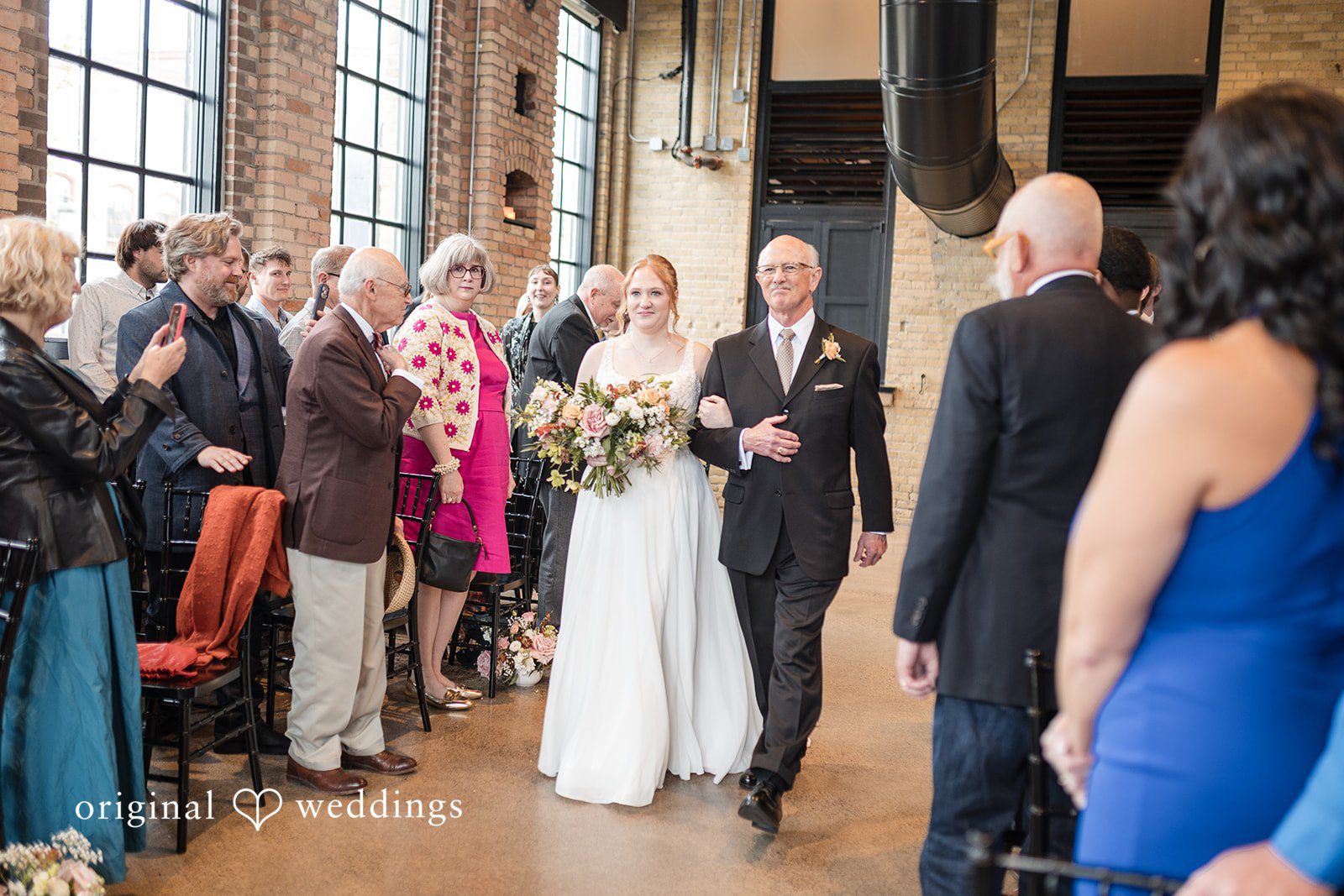 Elegant bride  wedding entrance moment at The Essence Event Center