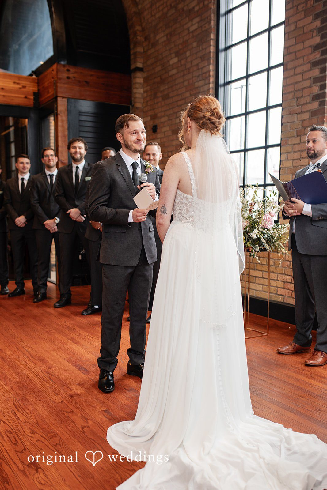 Romantic bride and groom vow moment at The Essence Event Center
