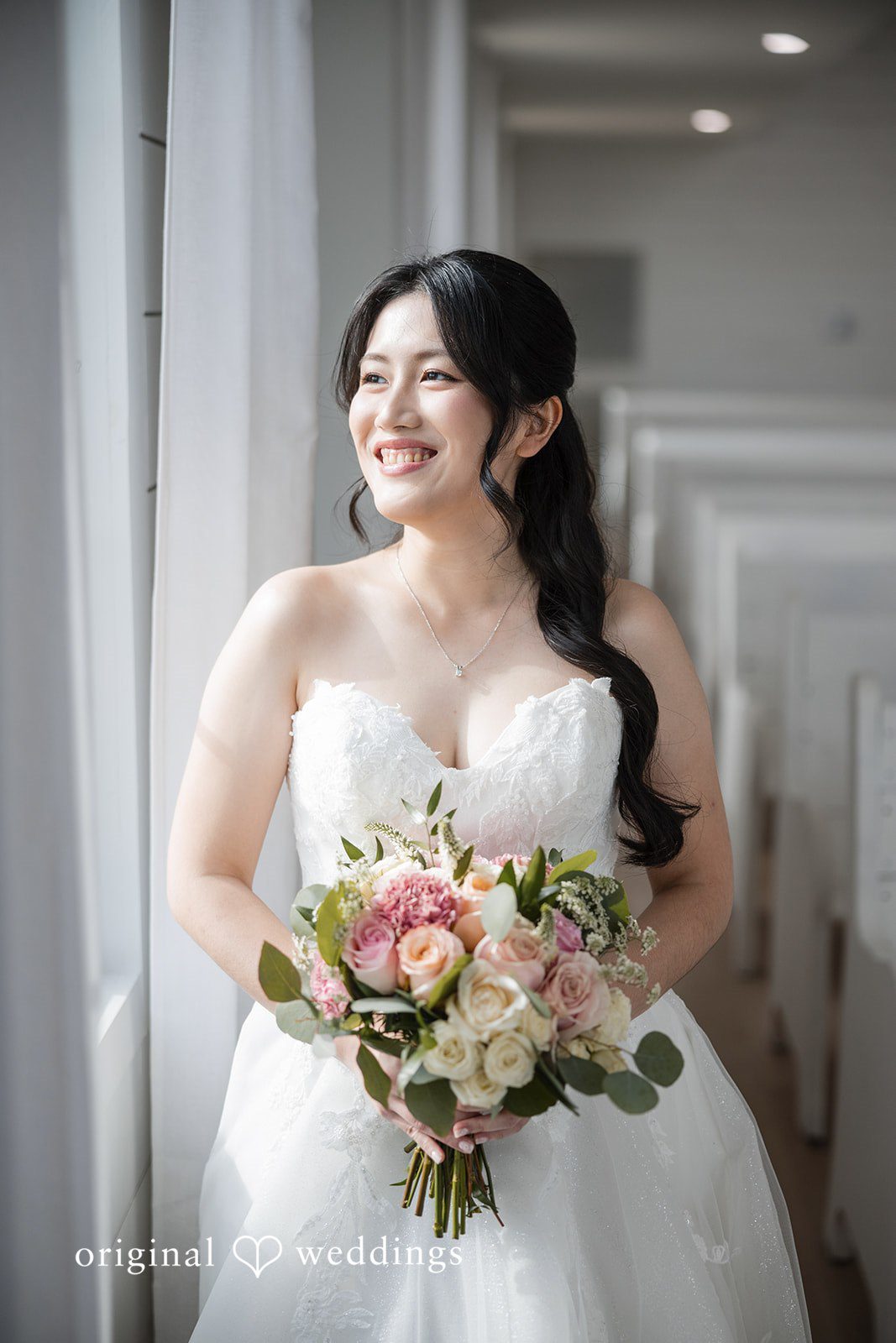 Anthony + Valen A solo shot of bride holding bouquet