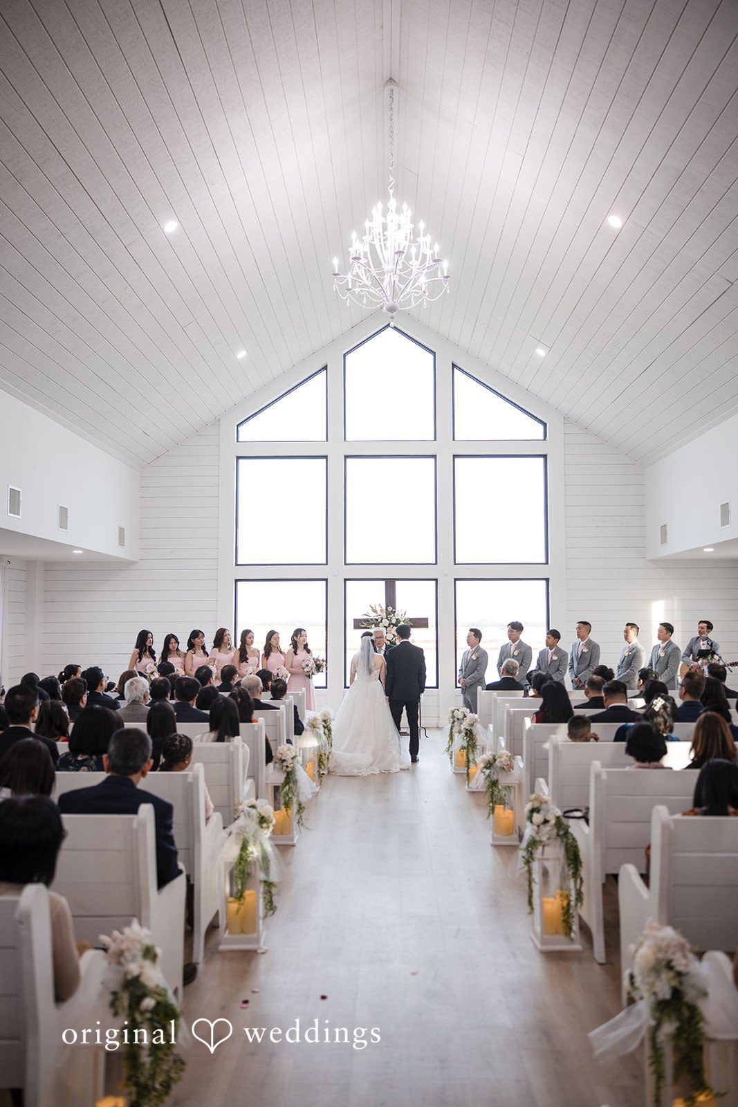 Anthony + Valen Ceremony picture of couple with guests around at The Gardenia
