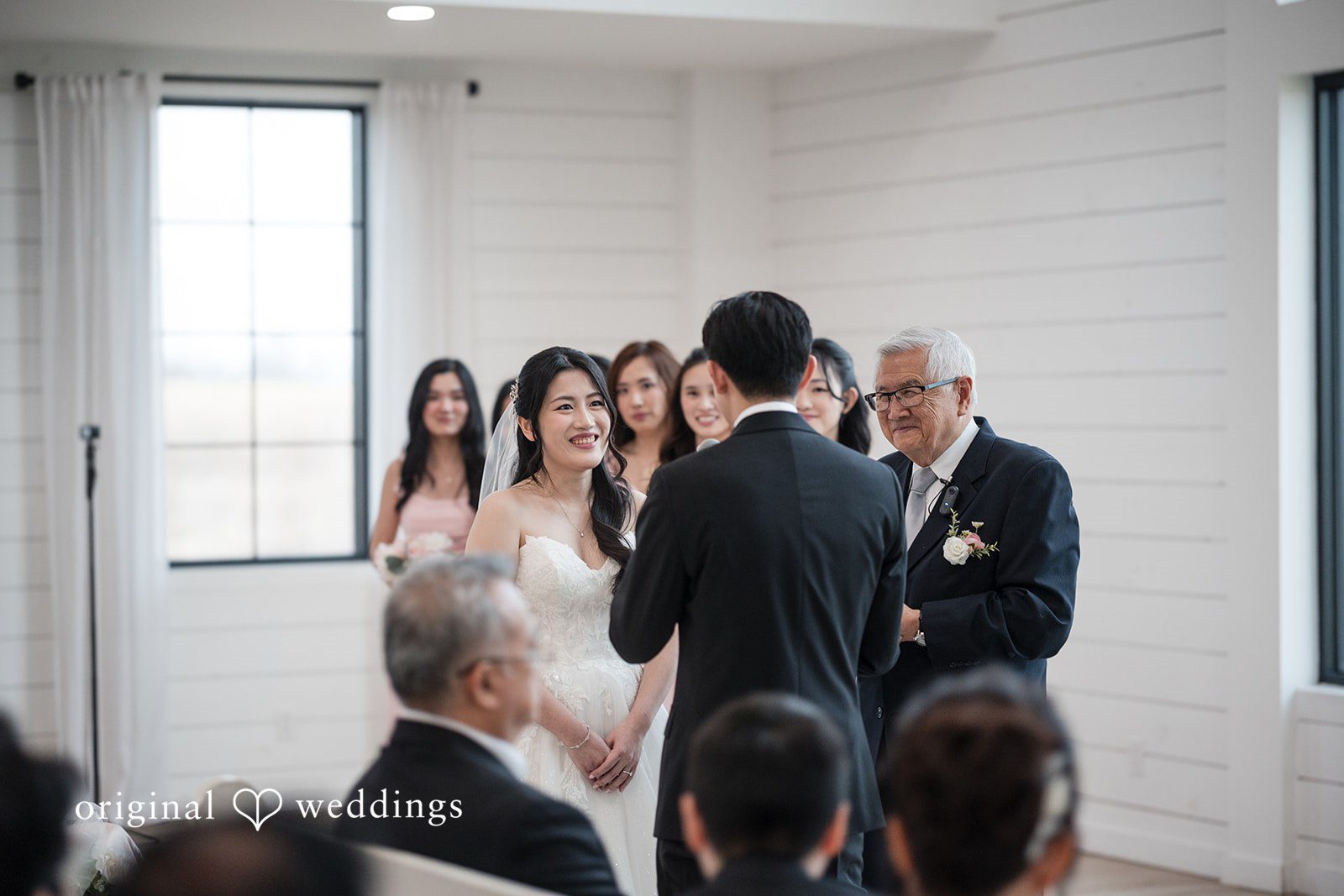Anthony + Valen Couple exchanging vows during wedding ceremony
