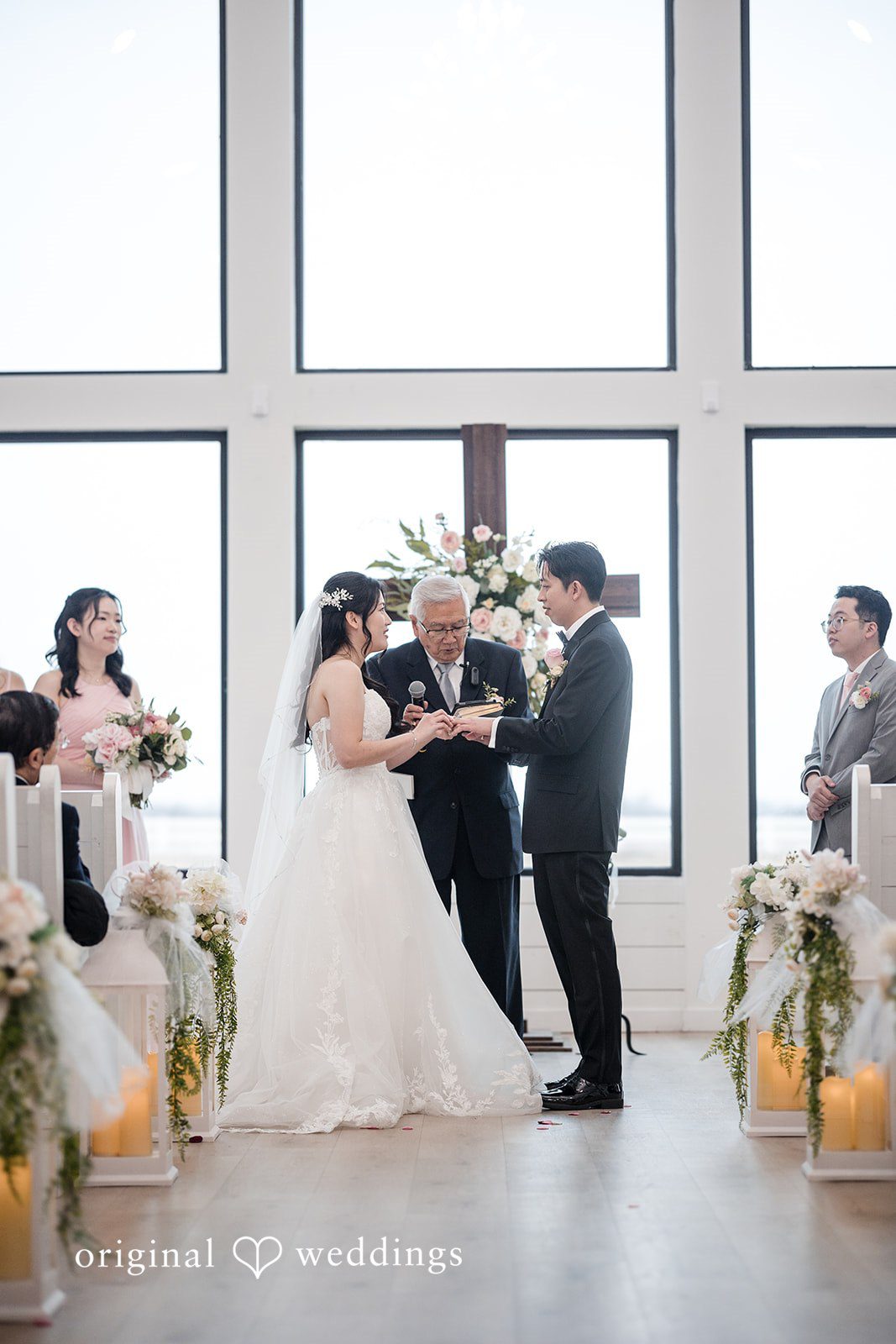 Anthony + Valen Beautiful couple exchanging wedding rings during ceremony
