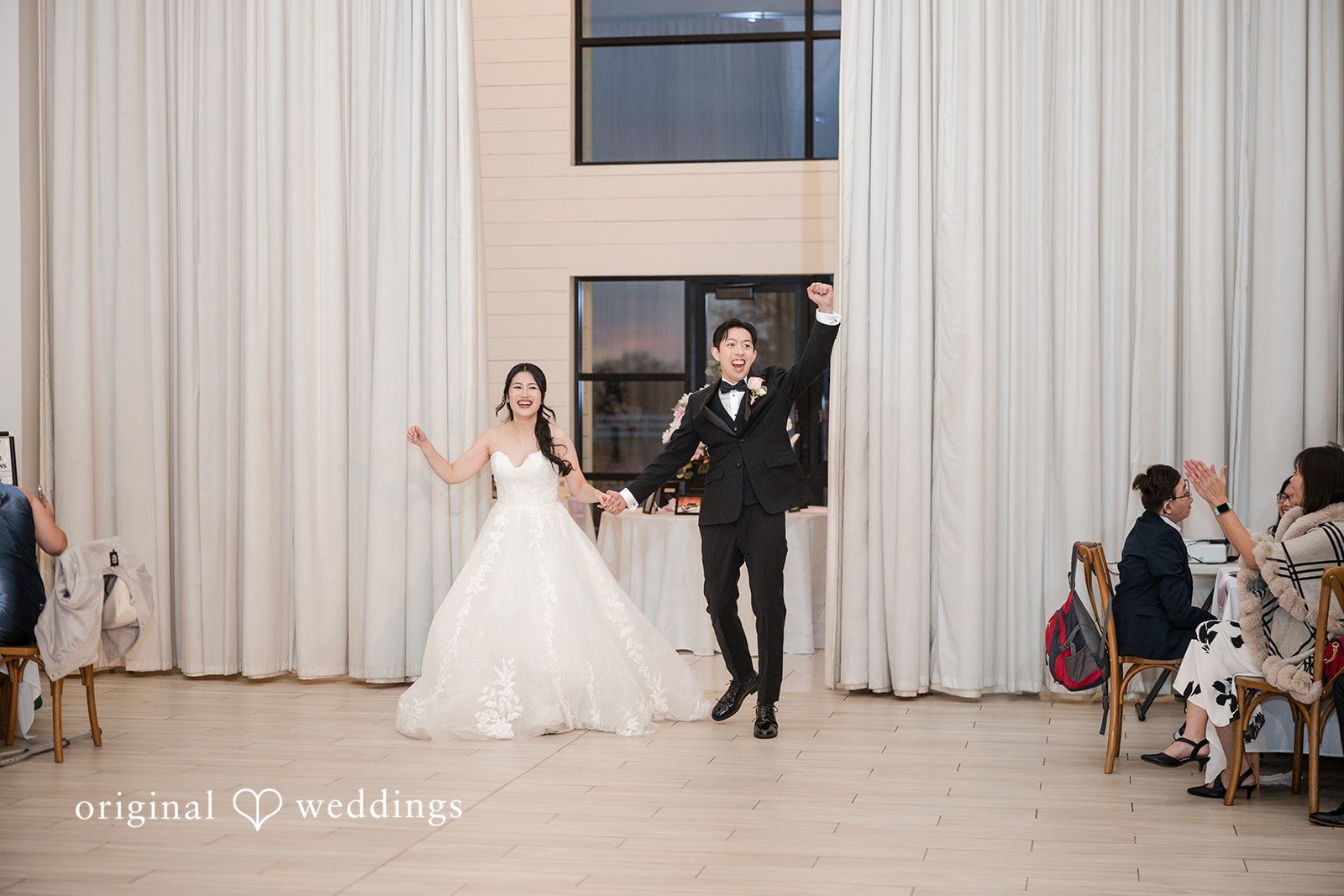 Anthony + Valen Couple entering the reception hallway happily