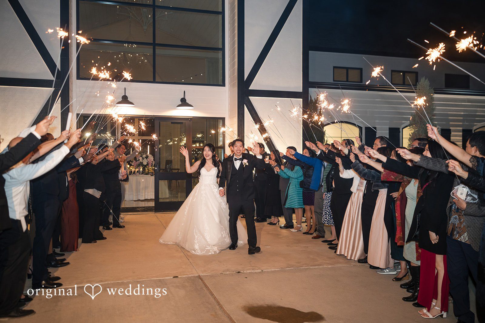Anthony + Valen Couple walking happily through the guests, cheering