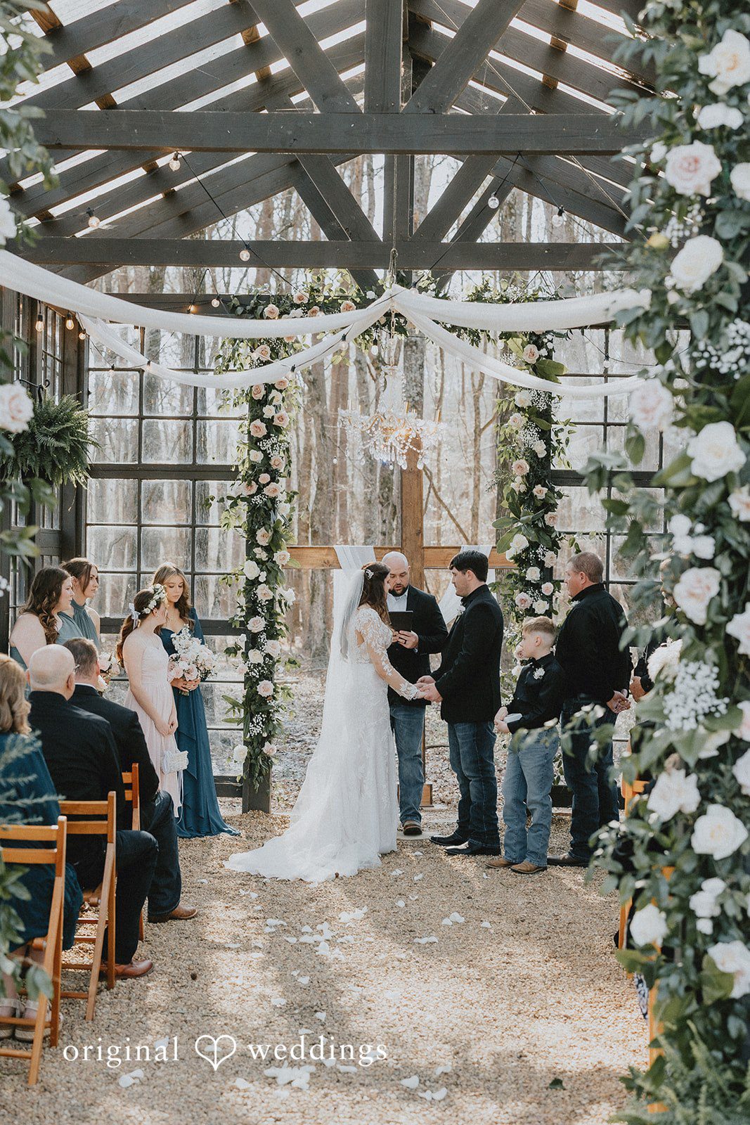 Couple holding hands during wedding ceremony