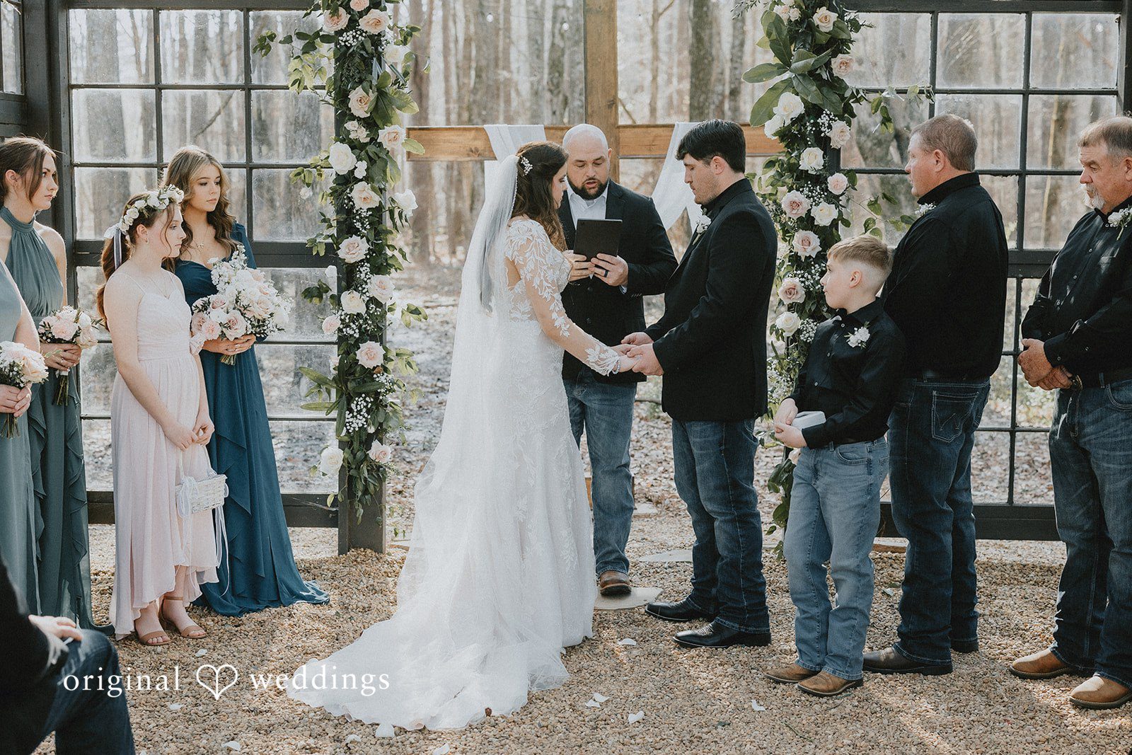 Couple holding hands during wedding ceremony