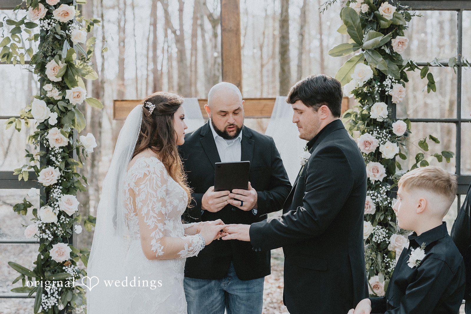 Elegant ceremony ring moment at The Glasshouse at Alabama Eden