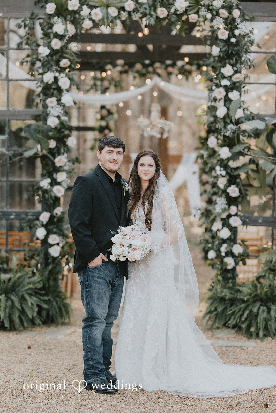 Couple posing together during ceremony at The Glasshouse at Alabama Eden