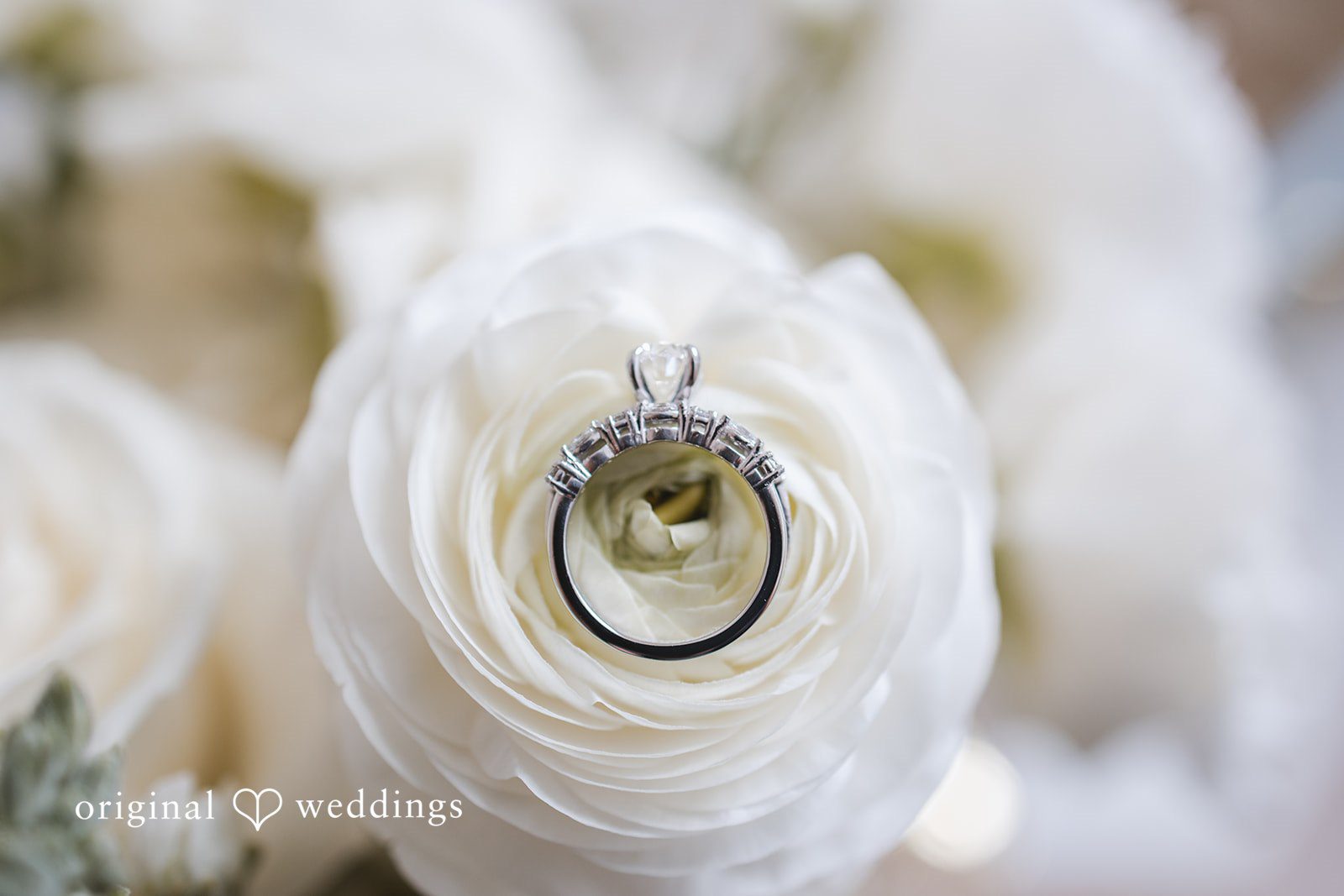 A detail shot of the wedding ring and bouquet
