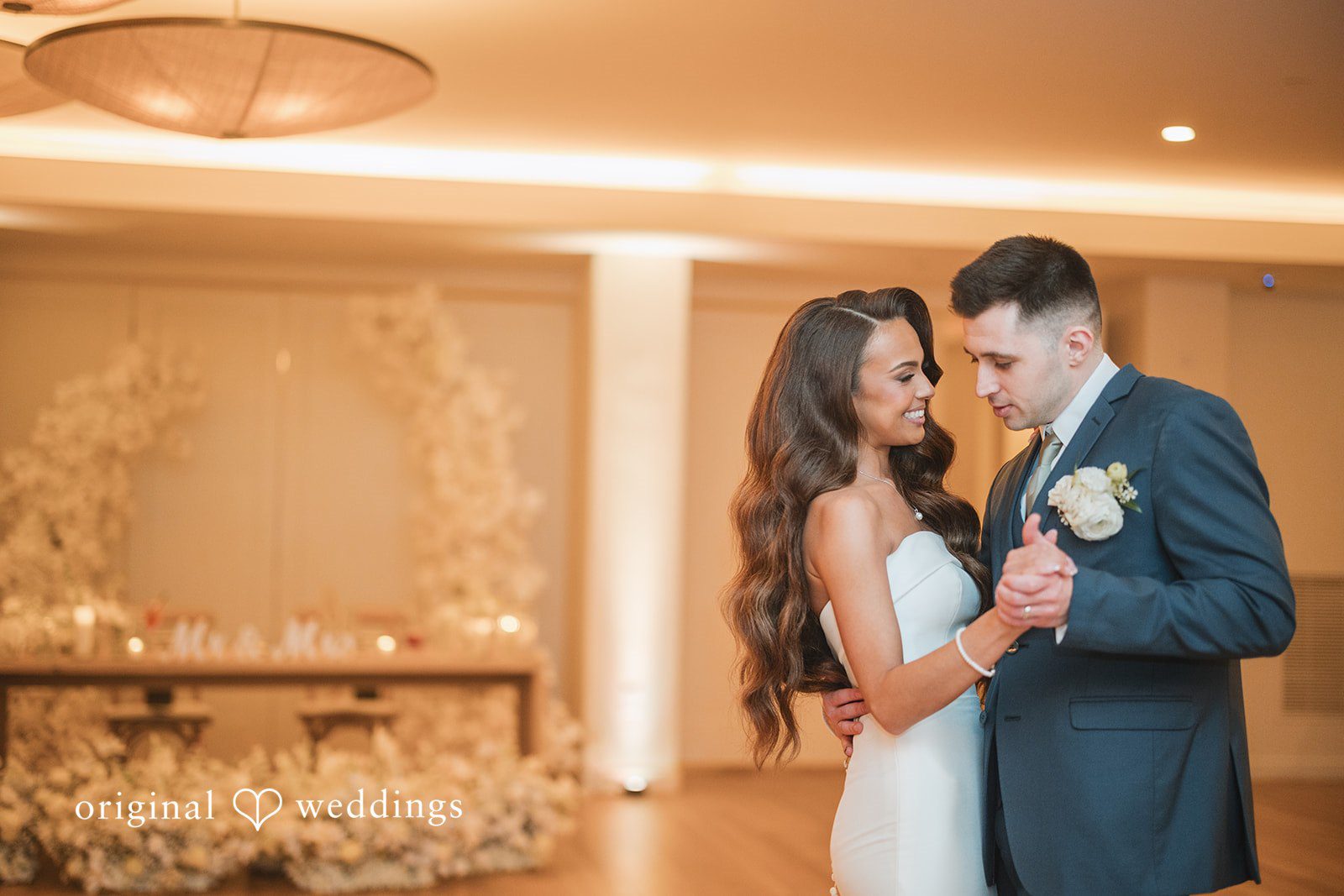 The couple takes their first dance