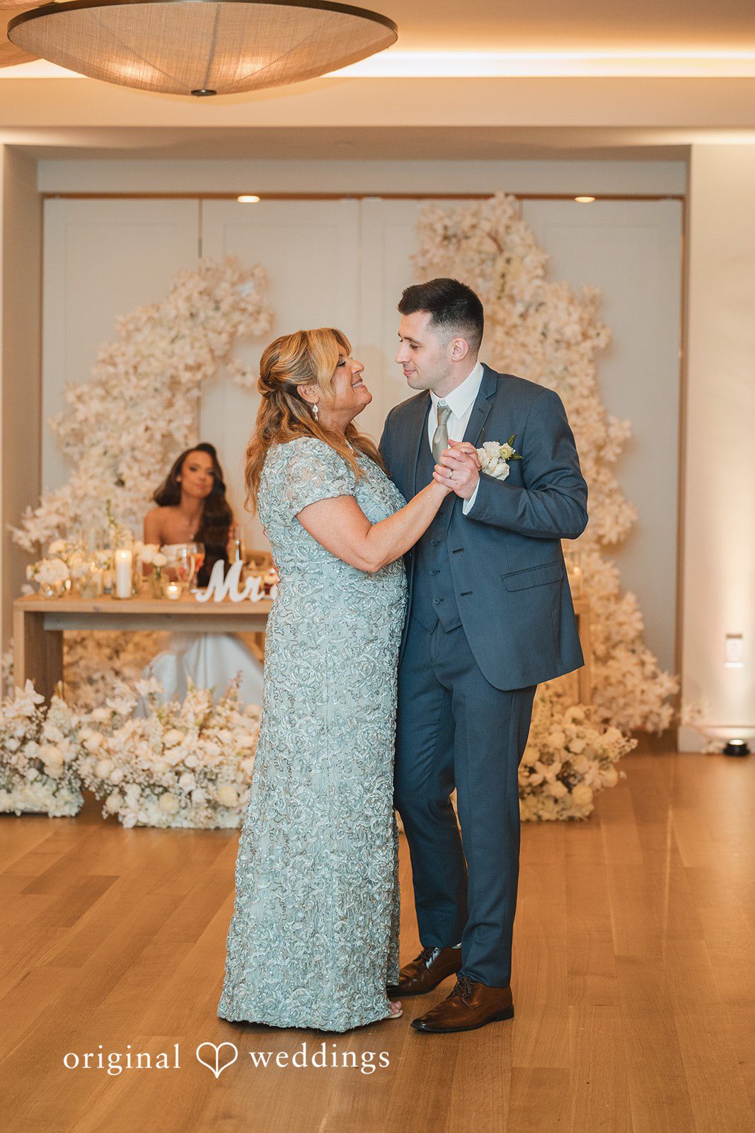 The groom dances with his mother