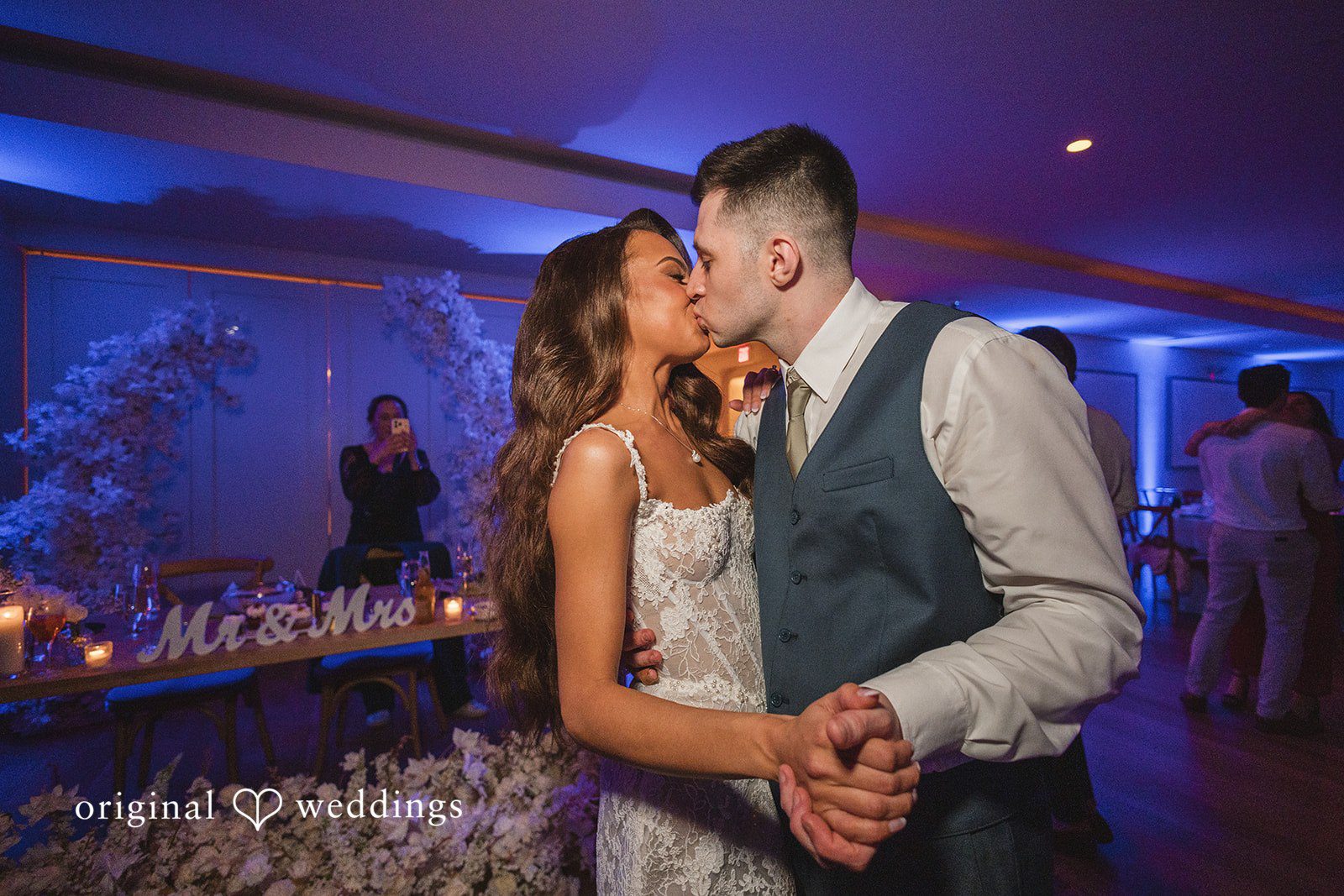 The couple shares a romantic kiss