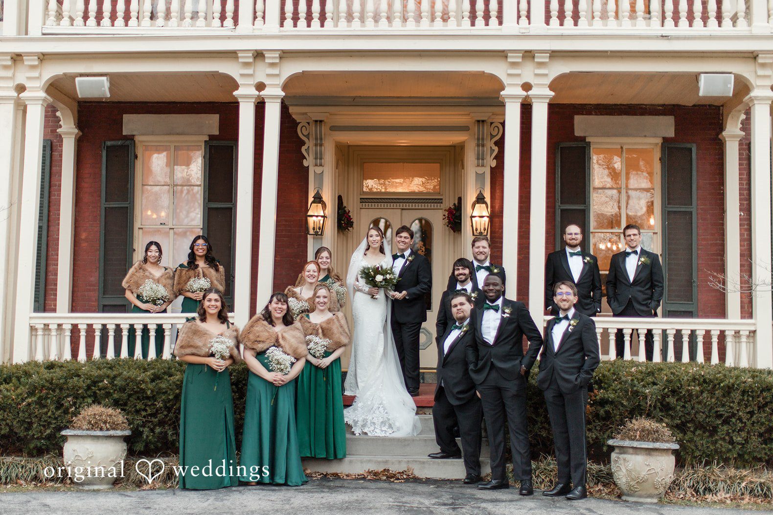 Wedding party group portrait in front of The Larimore captured by St. Louis wedding photographers with elegant historic backdrop