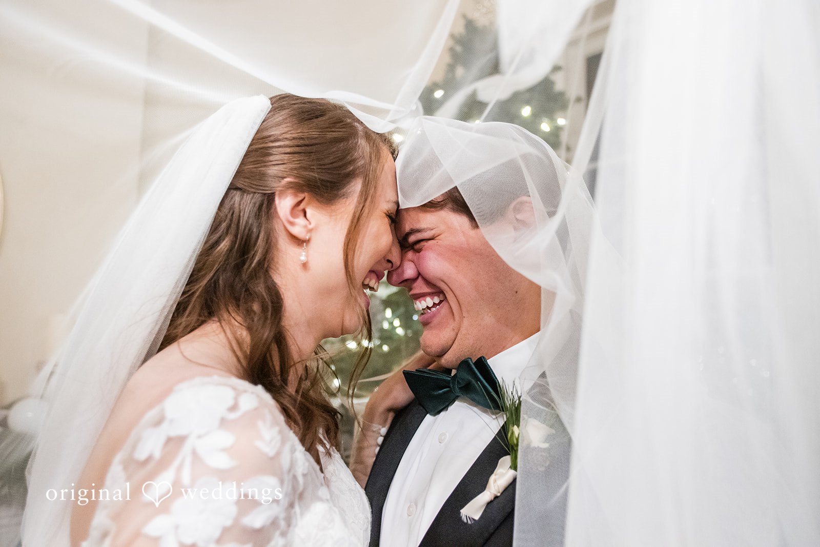 Adam + McKenzie Close up romantic portrait under veil with soft lighting
