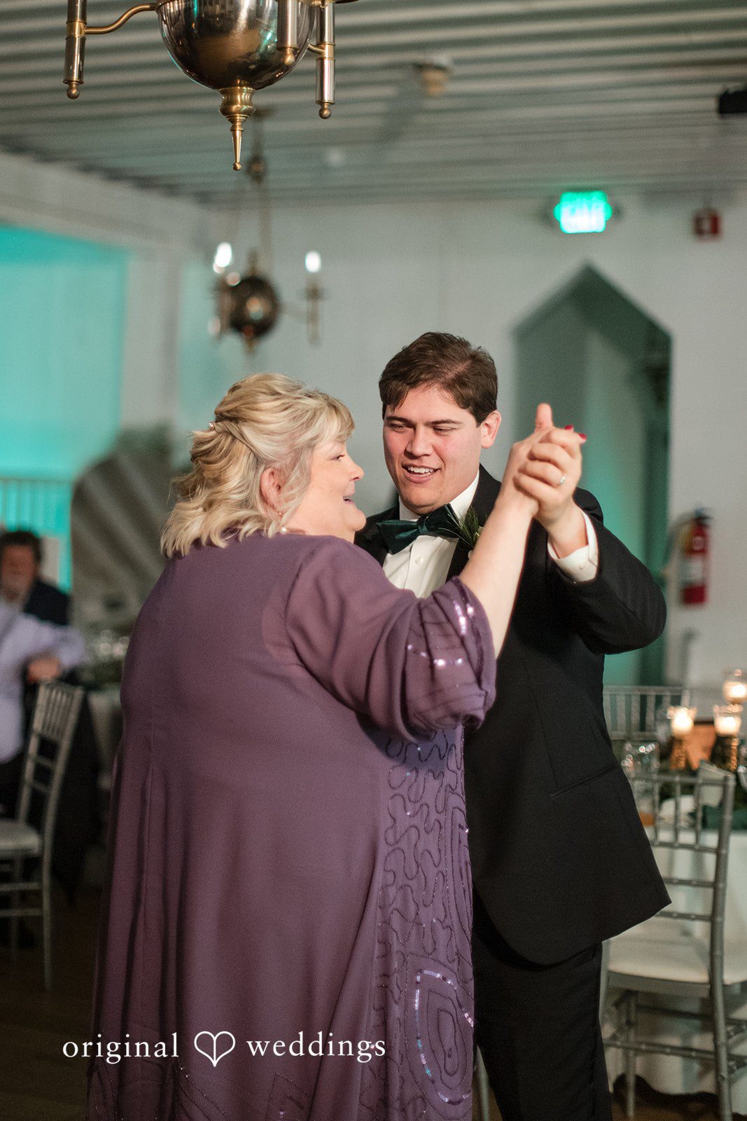Adam + McKenzie Dance floor candid with family member and groom enjoying the moment