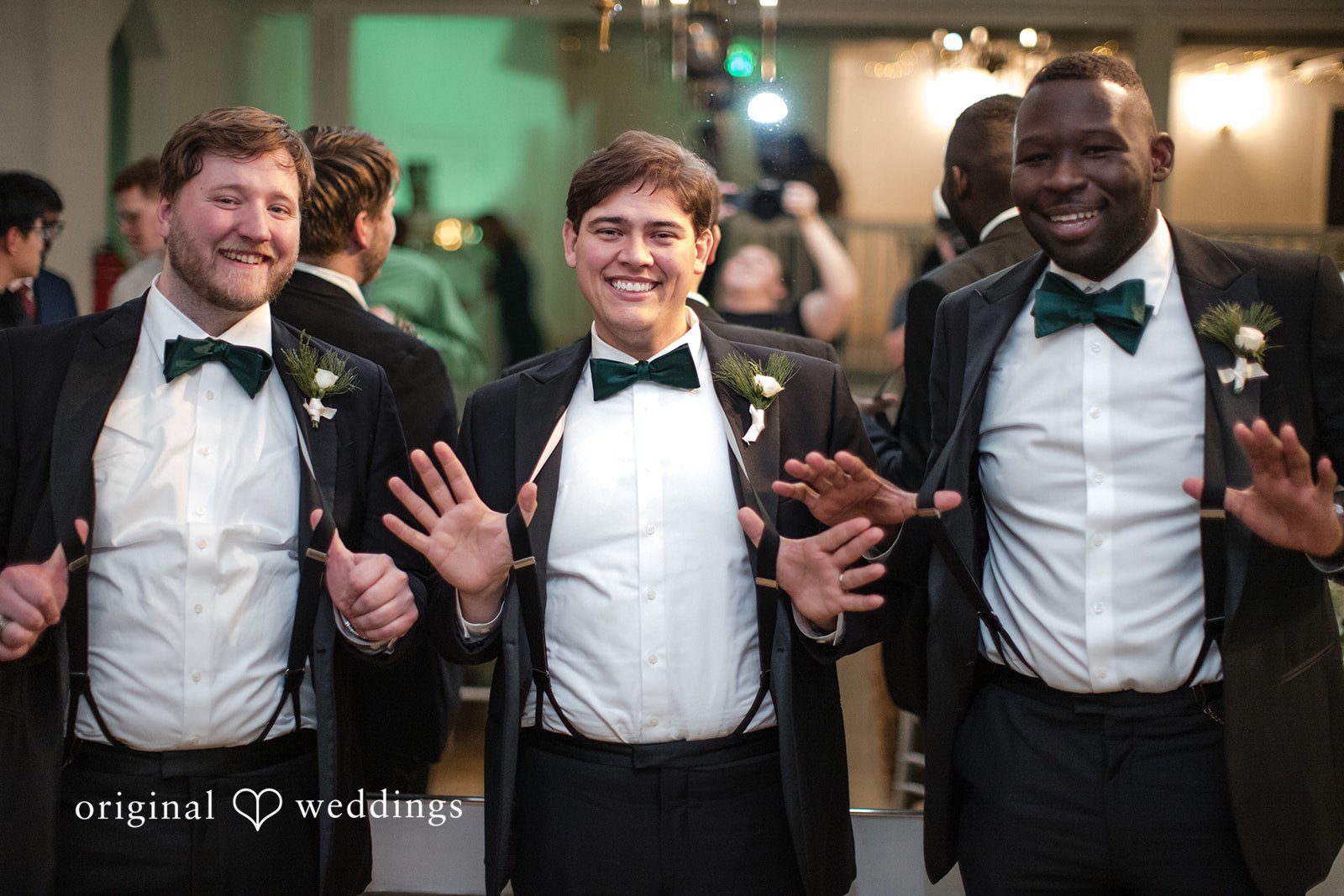 Adam + McKenzie Groom and guests entering reception space during lively moment